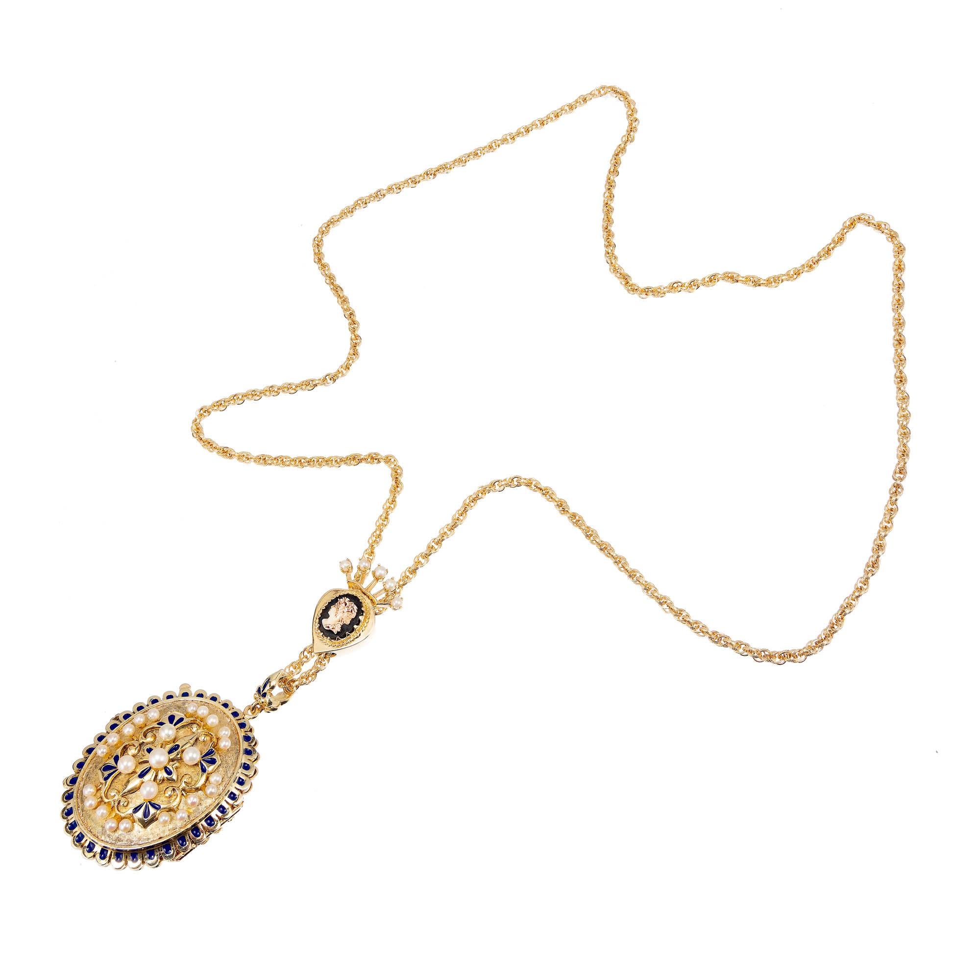 Original 1950’s pearl and enamel 14k yellow gold ornate locket necklace. Blue enamel and cultured Pearls on both sides, on a textured rope chain with a hardstone Cameo slide in the middle. 

1 Cameo 
2 Japanese cultured Pearls, 4.2mm 
8 cultured