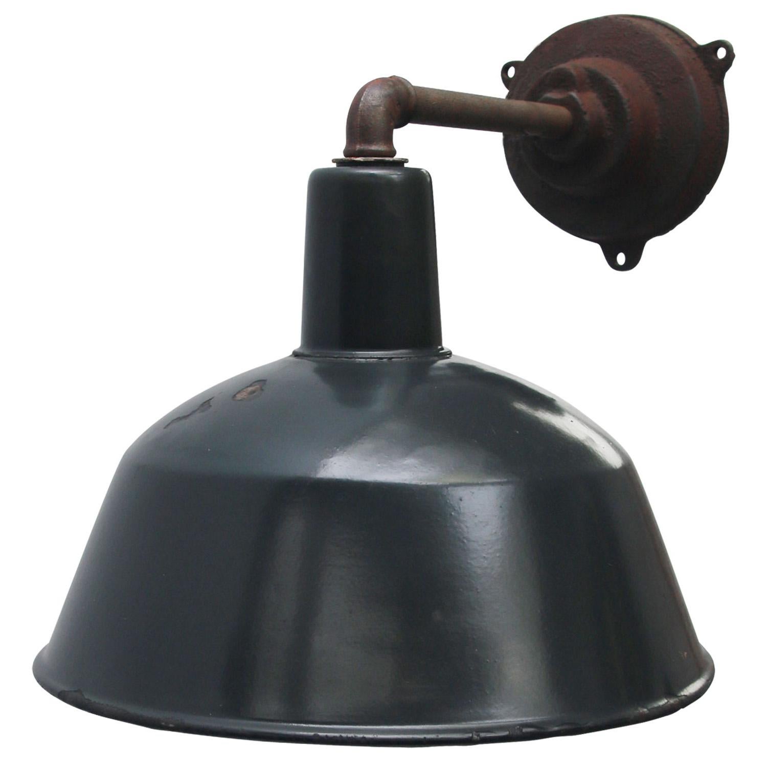 Factory wall light. Blue enamel. White interior.

Diameter cast iron wall piece: 12 cm, three holes to secure. 

Weight: 3.10 kg / 6.8 lb

Priced per individual item. All lamps have been made suitable by international standards for