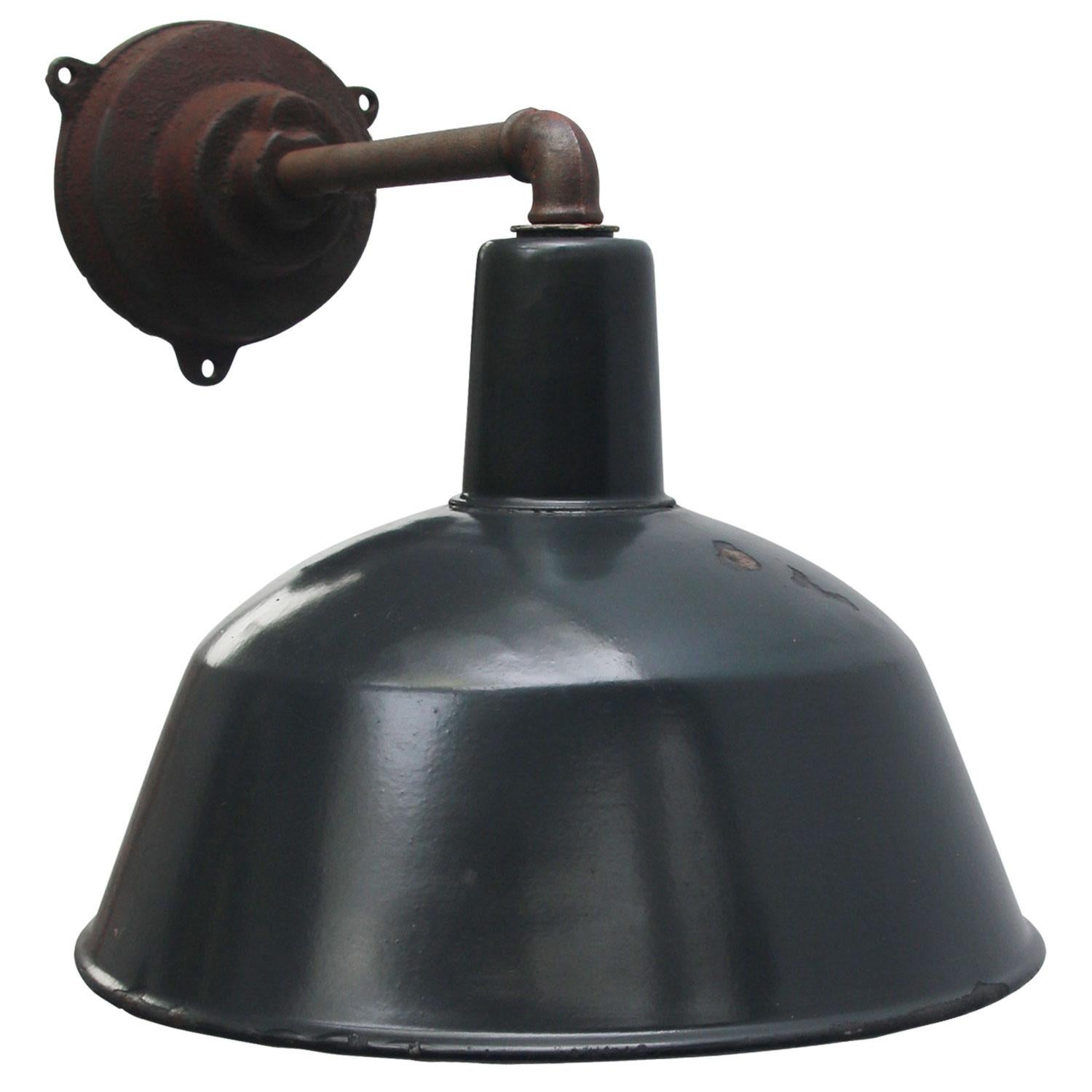 Factory wall light. Blue enamel. White interior.
Diameter cast iron wall piece: 12 cm, three holes to secure. 

Weight: 3.10 kg / 6.8 lb

Priced per individual item. All lamps have been made suitable by international standards for incandescent