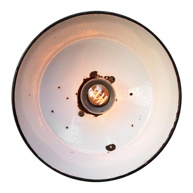 Blue enamel industrial wall light. White enamel interior, cast iron top and arm and wall piece.
Diameter cast iron wall mount: 9 cm, three holes to secure.

Weight: 6.7 kg / 14.8 lb

Priced per individual item. All lamps have been made suitable