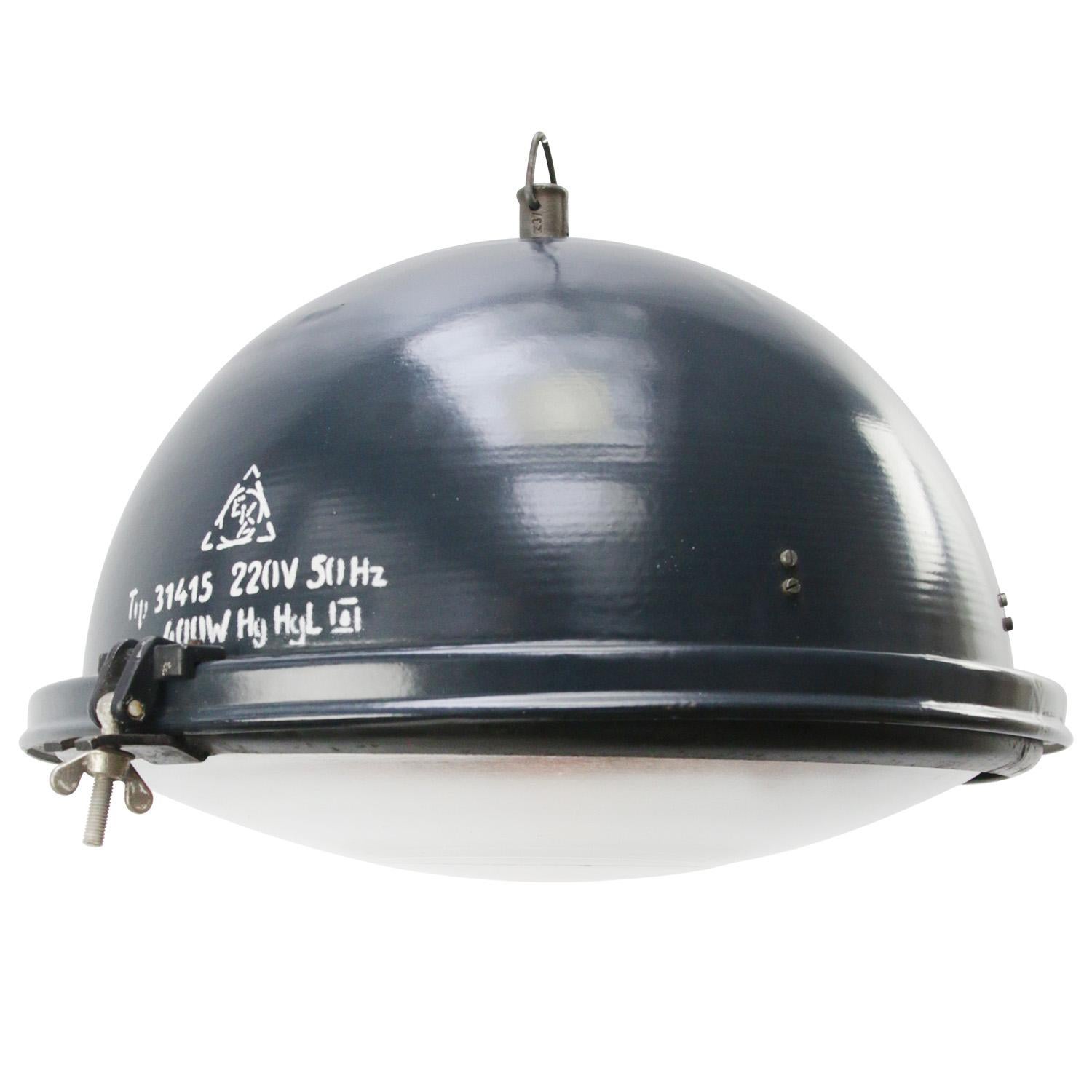 Factory pendant. Blue enamel white interior. Cast iron hook.
Clear glass.

Weight: 5.50 kg / 12.1 lb

Priced per individual item. All lamps have been made suitable by international standards for incandescent light bulbs, energy-efficient and