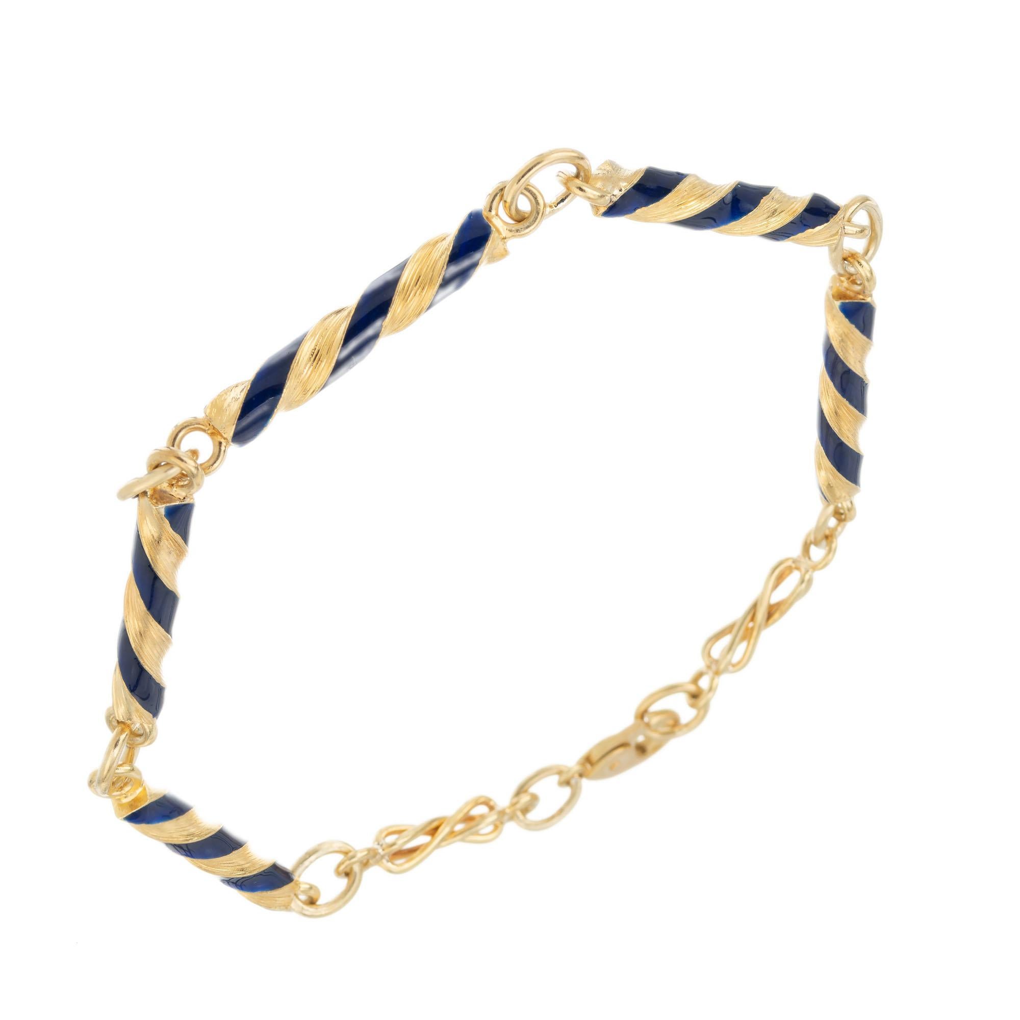 Five section swirl link blue enamel 18k yellow gold 8 Inch Bracelet.

Blue enamel
18k yellow gold 
Stamped: K18
10.0 grams
Bracelet: 8 Inches
Width: 3.6mm
Depth or thickness: 3.6mm
