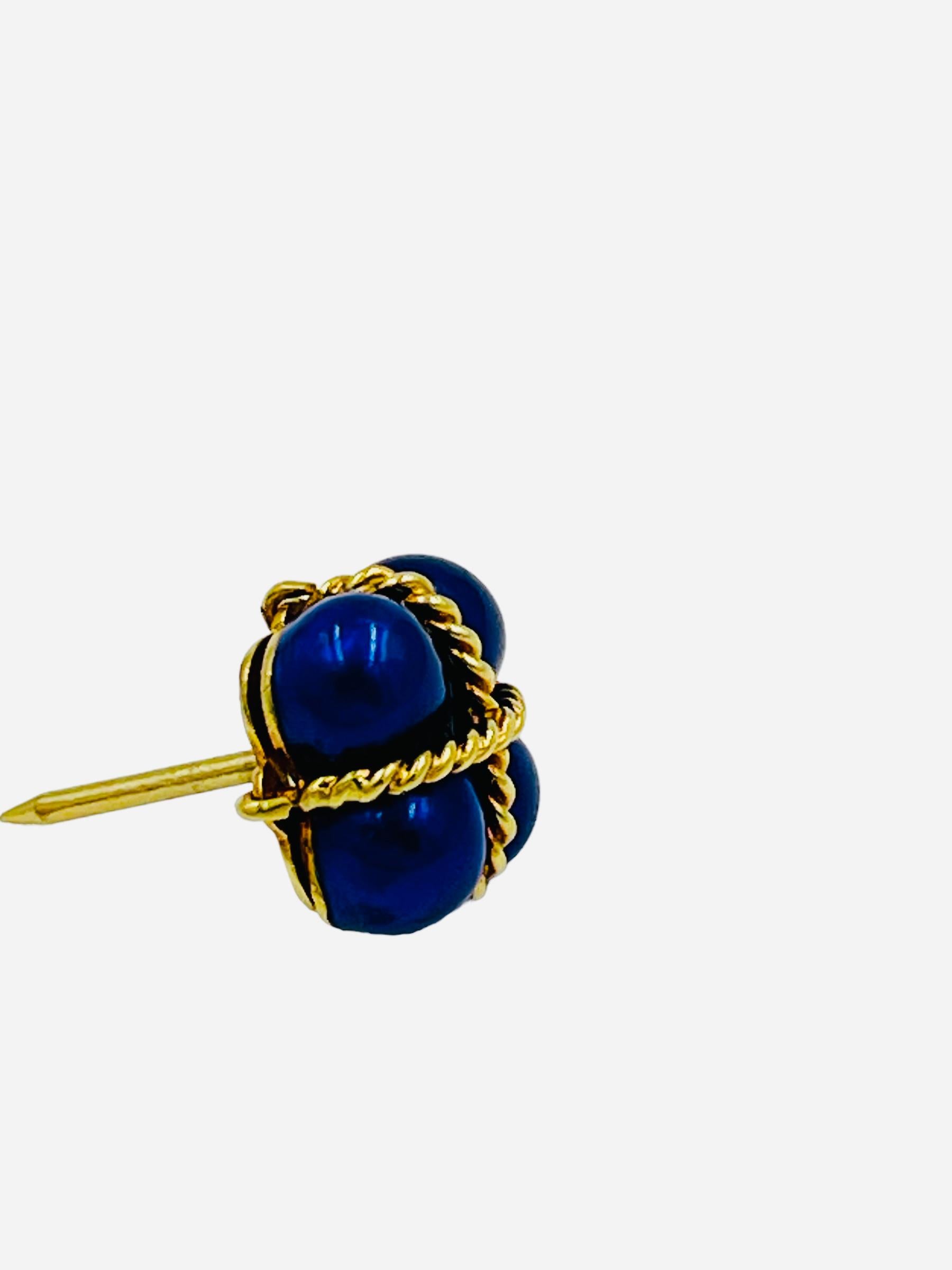 Vintage 18k yellow gold Blue Enamel Lapel pin, Tie tack, circa 1980s.  It's beautifully crafted with a highly detailed twisted rope design wrapped around the enameled tie-tac.

It measures 11mm by 11mm weighing about 3.7 grams without the backing. 