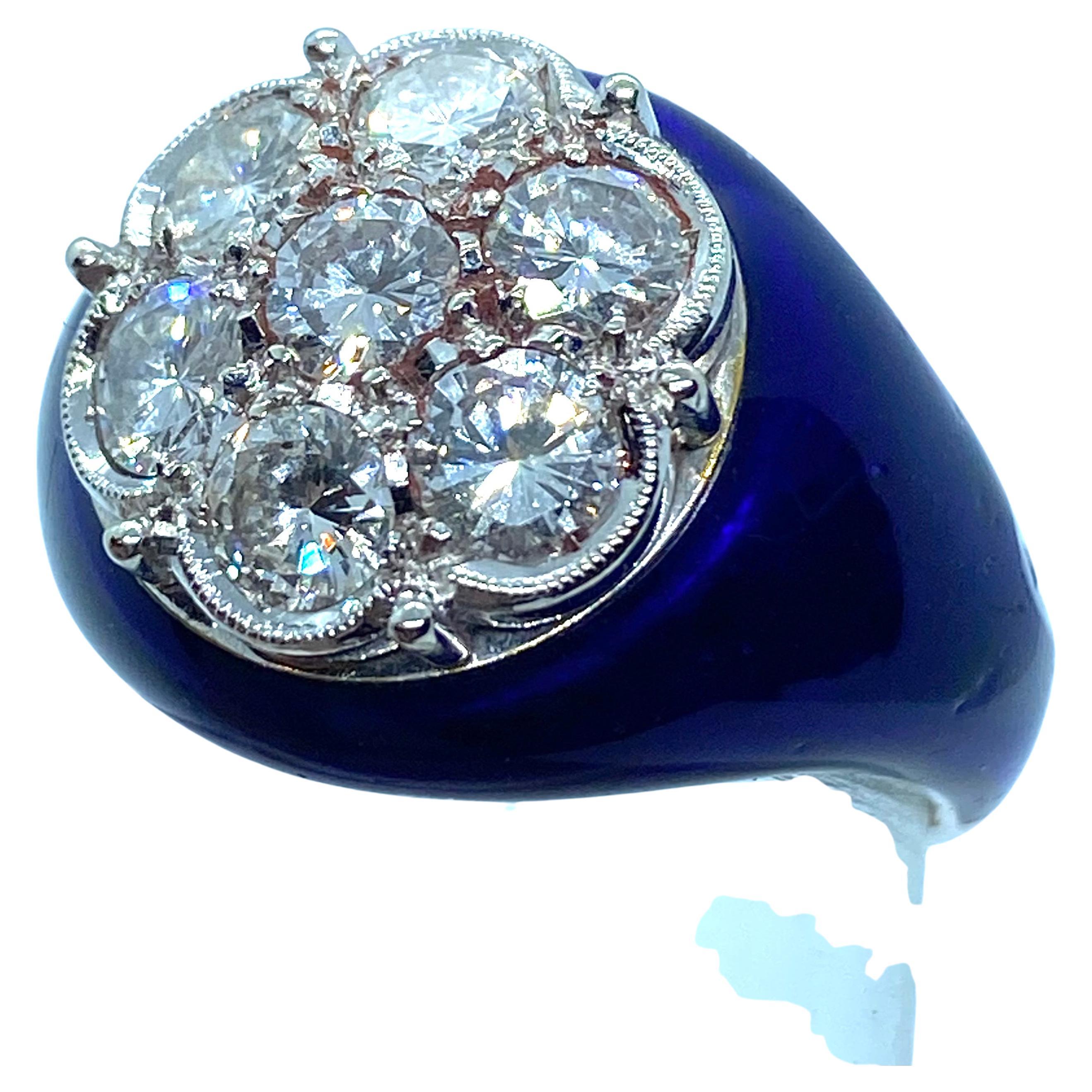 Rounded ring in 18K white gold, blue enamelled.
It bears 7 natural brilliant-cut diamonds, for a total weight of over 3 ct.  
Excellent color and purity
Italian production of the second half of XXth century
