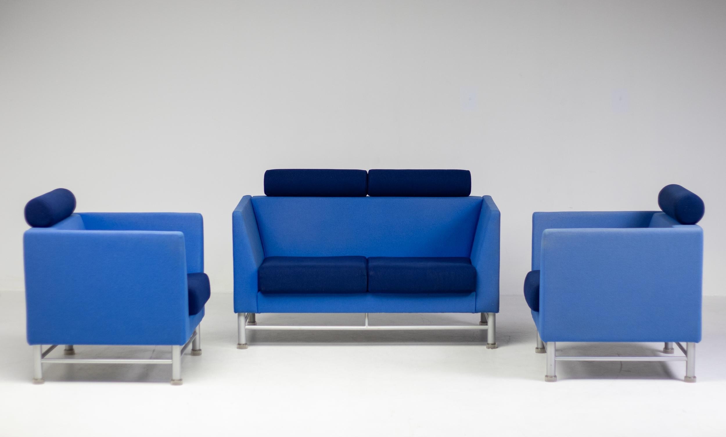 Spectacular East Side sofa and 2 lounge chairs designed by Ettore Sottsass for Knoll International in 1983. 
Post-Modern sofa and armchairs with their original two-tone blue Kvadrat Tonus upholstery in nice vintage condition. The set features a