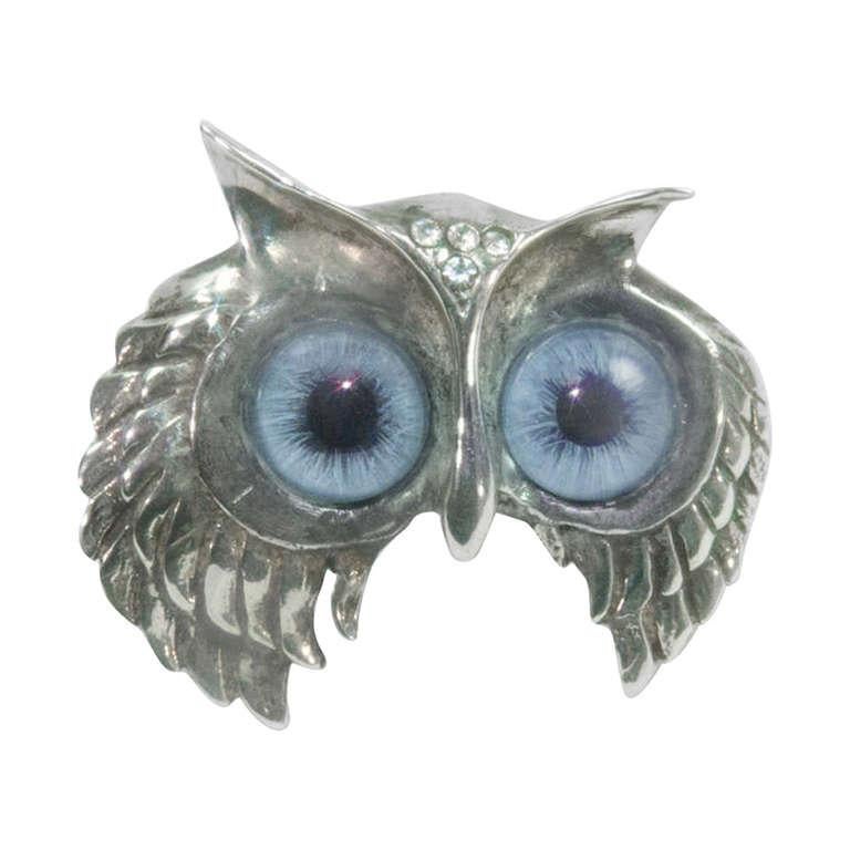 Alluring Owl Sterling Silver pin brooch, featuring cabochon glass eyes and accented by sparkling CZ in the forehead; marked: STERLING; approx. pin size: 1.75” x 1.5”. Illuminate your look and add pizazz to any outfit!