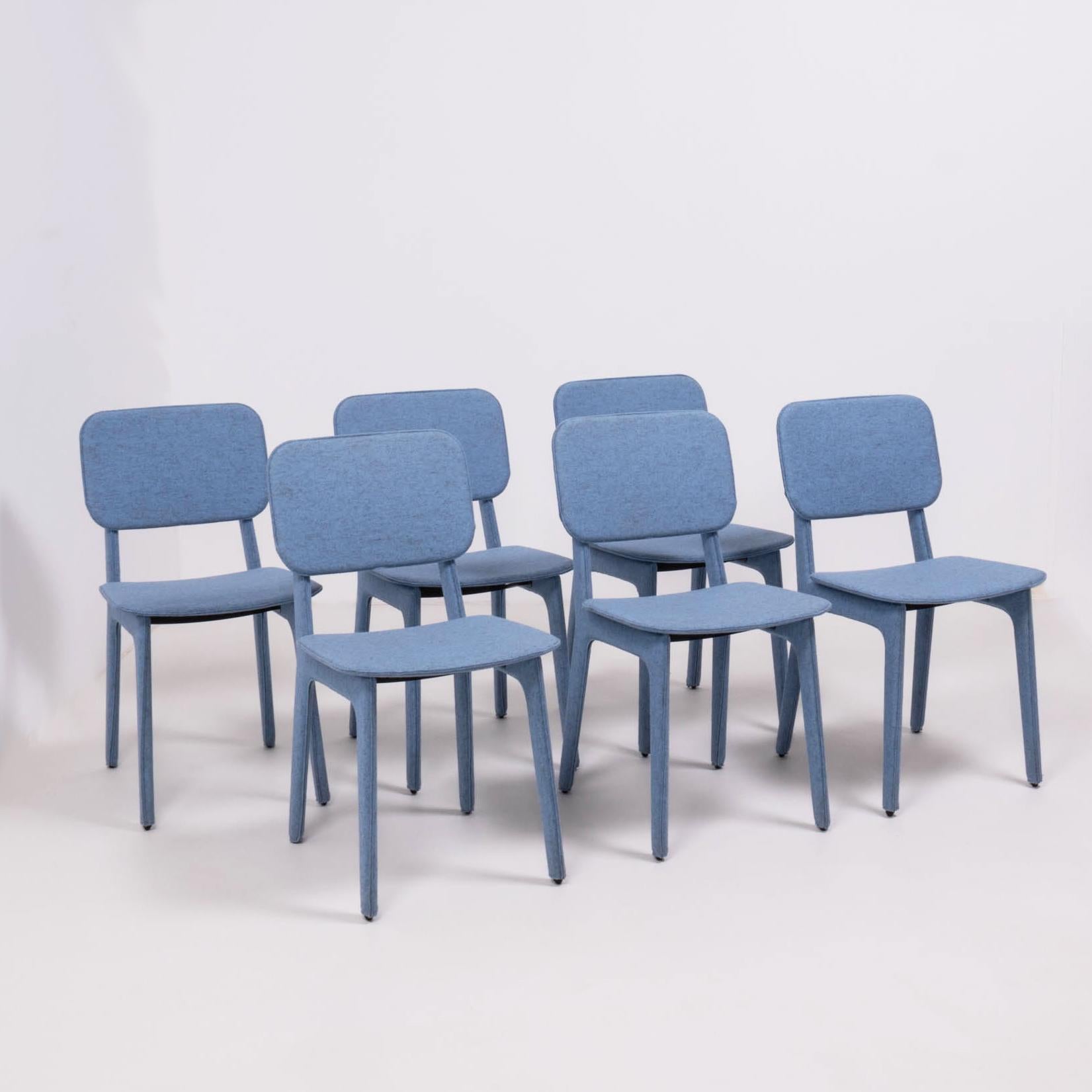 Designed by Delo Lindo for Ligne Roset in 2012, the blue felt chair combines comfort and simplicity.

Constructed from molded beech ply with steel base profiles, the chairs have 
Foam seat pads and are completely upholstered in blue wool felt.

The