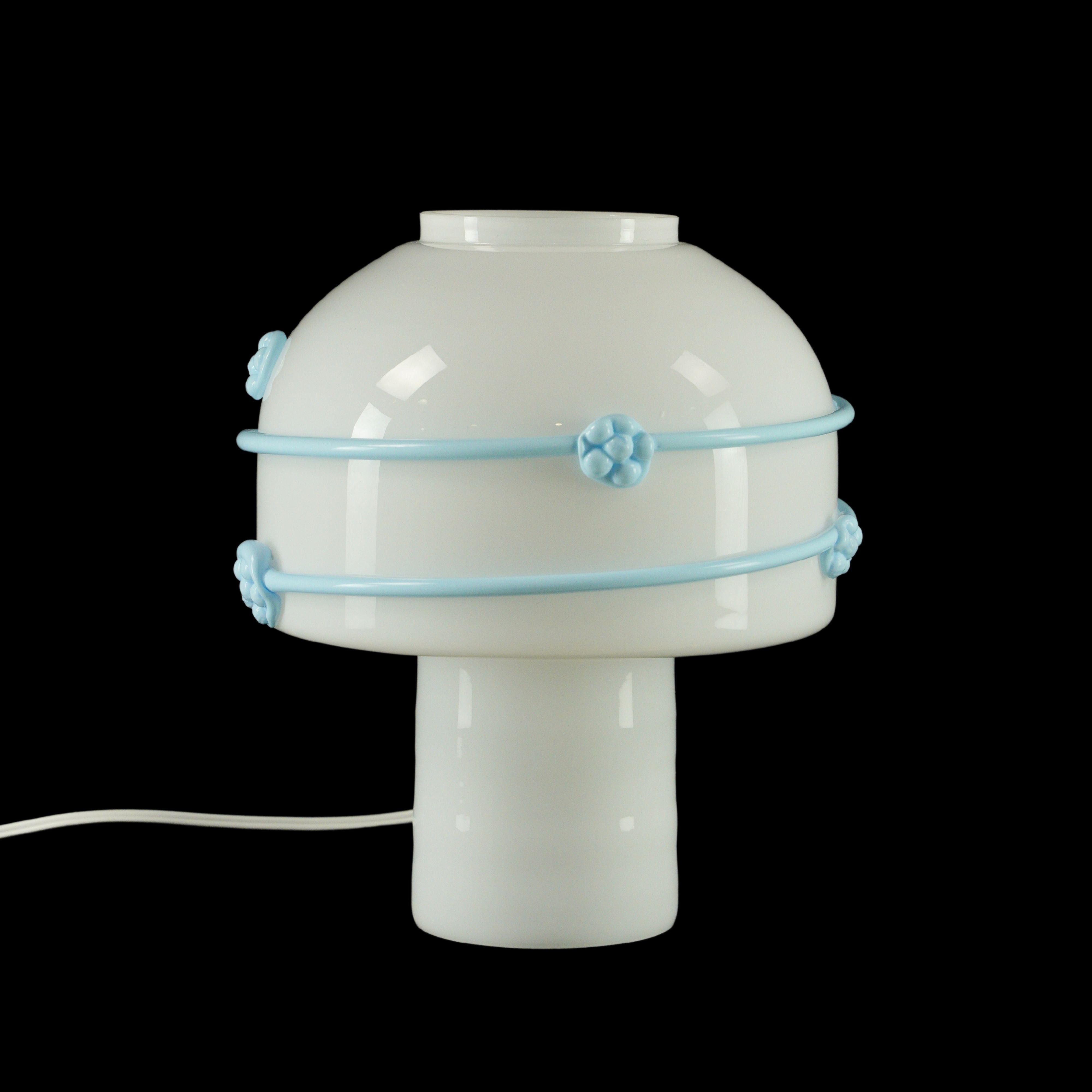 White Murano glass mushroom shaped table or desk lamp with blue floral line details. This requires one standard medium base bulb. This light is wired and ready to ship. Cleaned and restored. Good condition with appropriate wear from age. One