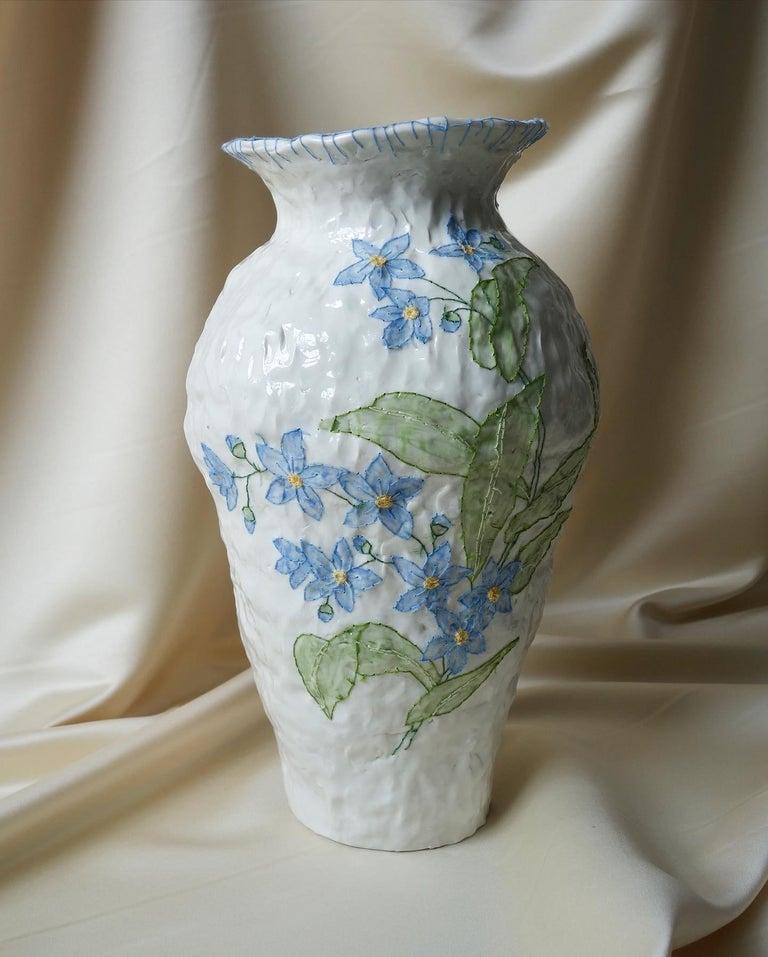 Blue flower Emboridery vase by Caroline Harrius
Dimensions: 45 H cm
Material: Porcelain

The pieces with emboridery is about 45 cm high, coiled in porcelain, painted with slip, glazed on the outside. After the final firing they are emboridered