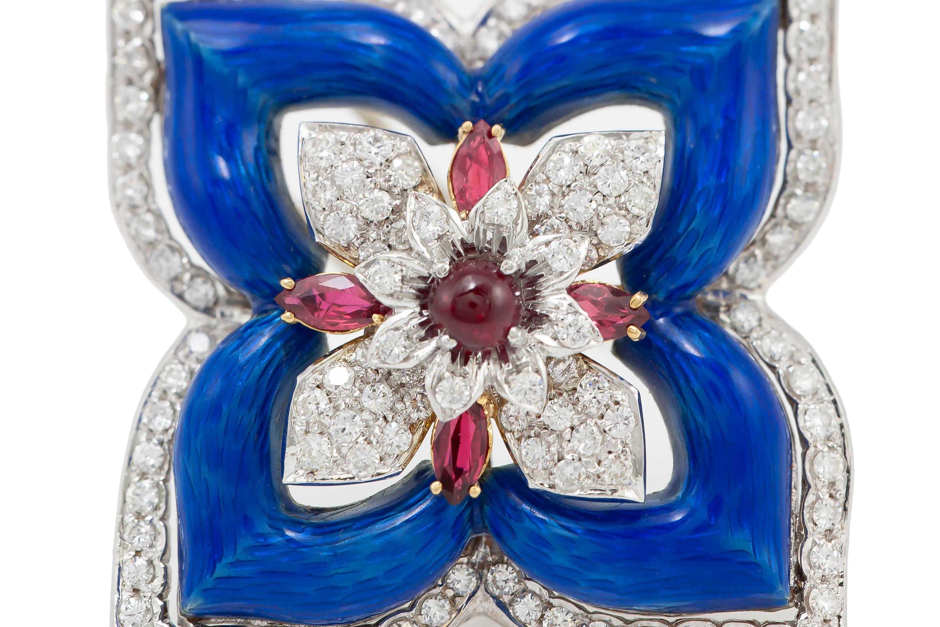 Beautiful flower pin finely crafted in 18k white and yellow gold. 
Blue enamel details with diamonds weighing approximately 6.00ct and rubies weighing approximately 1.00ct.