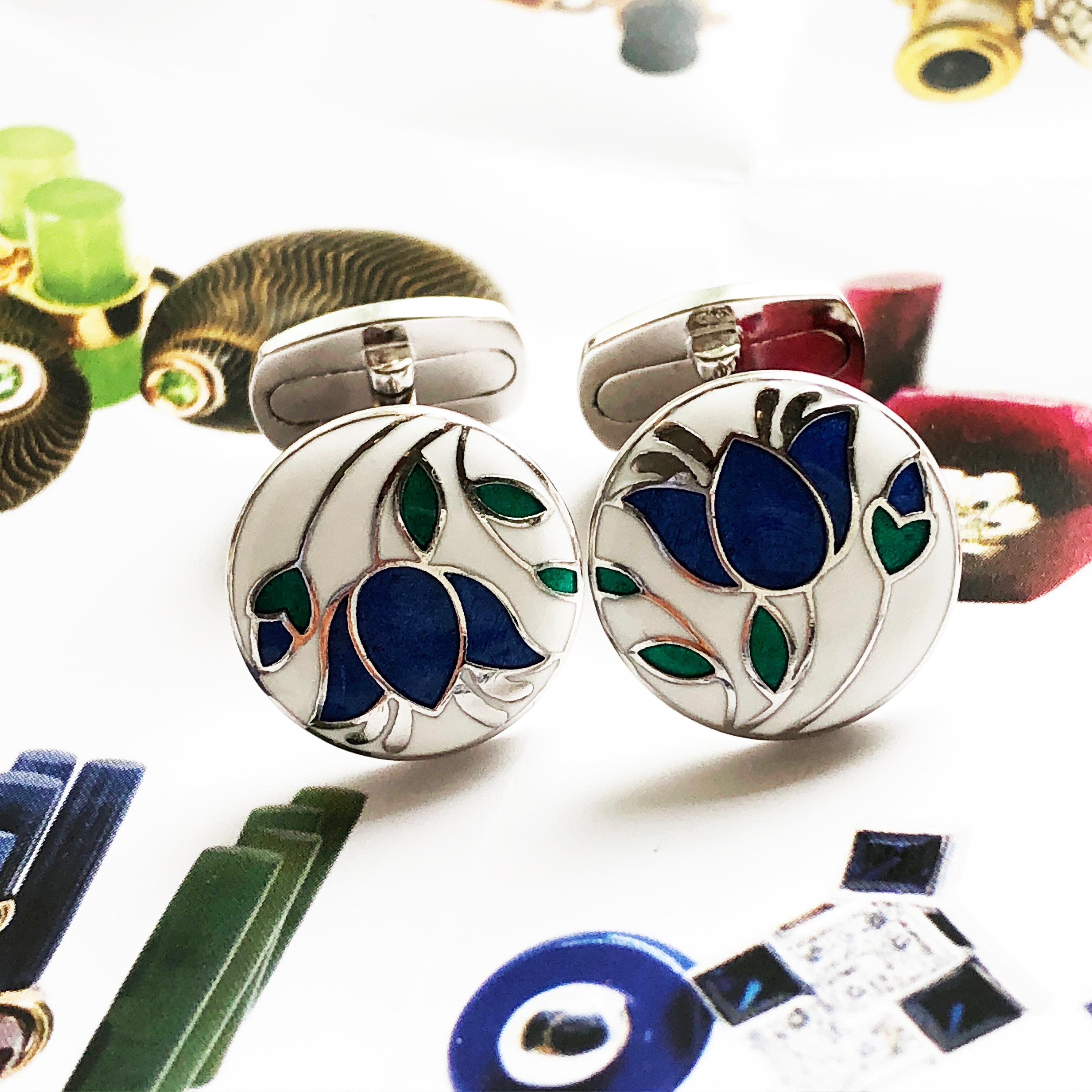 Chic, Unique yet Timeless Hand Enameled Blue Flower, Green Leaves, in a Round White Setting Cabochon Sterling Silver Cufflinks, T-bar back.
In our Smart Black Box and Pouch.

Front Diameter about 0.596 inches.