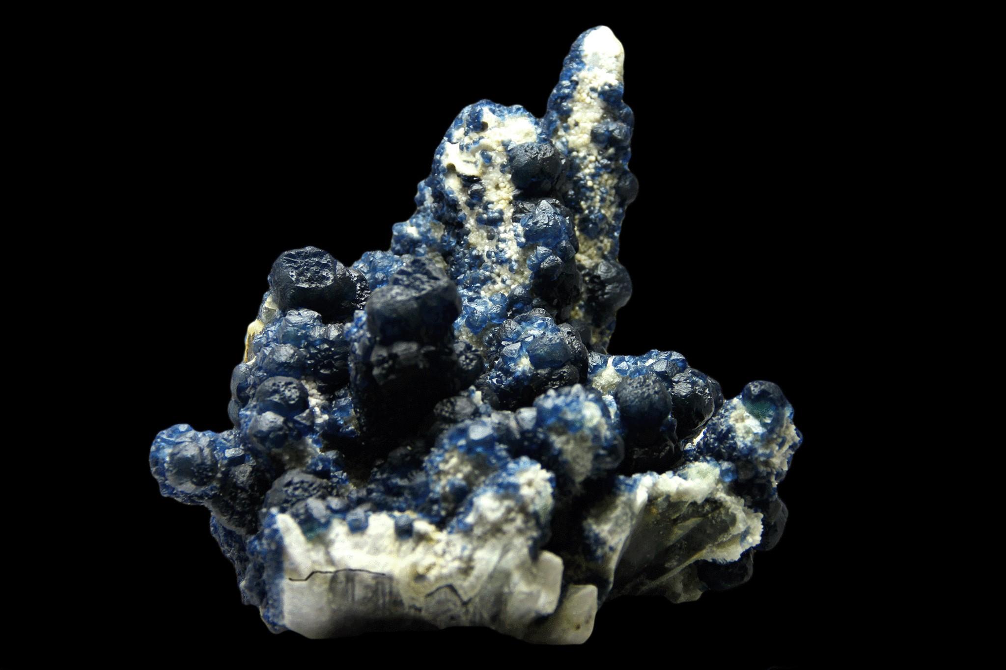 From Huanggang Fe-Sn deposit, Hexigten Banner, Ulanhad League, Inner Mongolia, China

 

Large stalactitic formation of quartz covered by a second generation of translucent navy blue cubo-octahedral Fluorite crystals. The fluorite crystals have