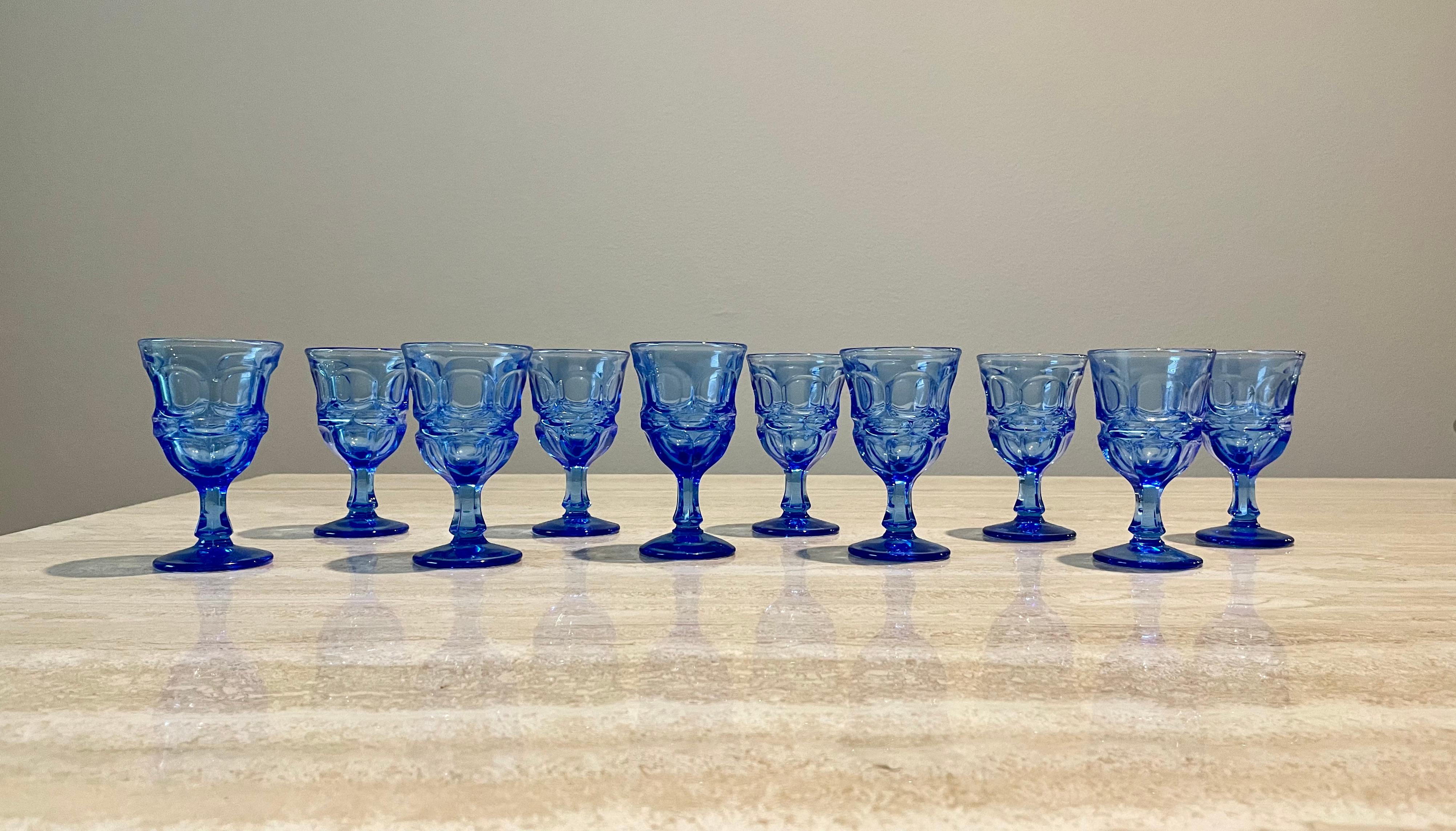 Set of 10 Blue Fostoria Cordial glasses. Great decorative and functional shot glasses for a home bar.