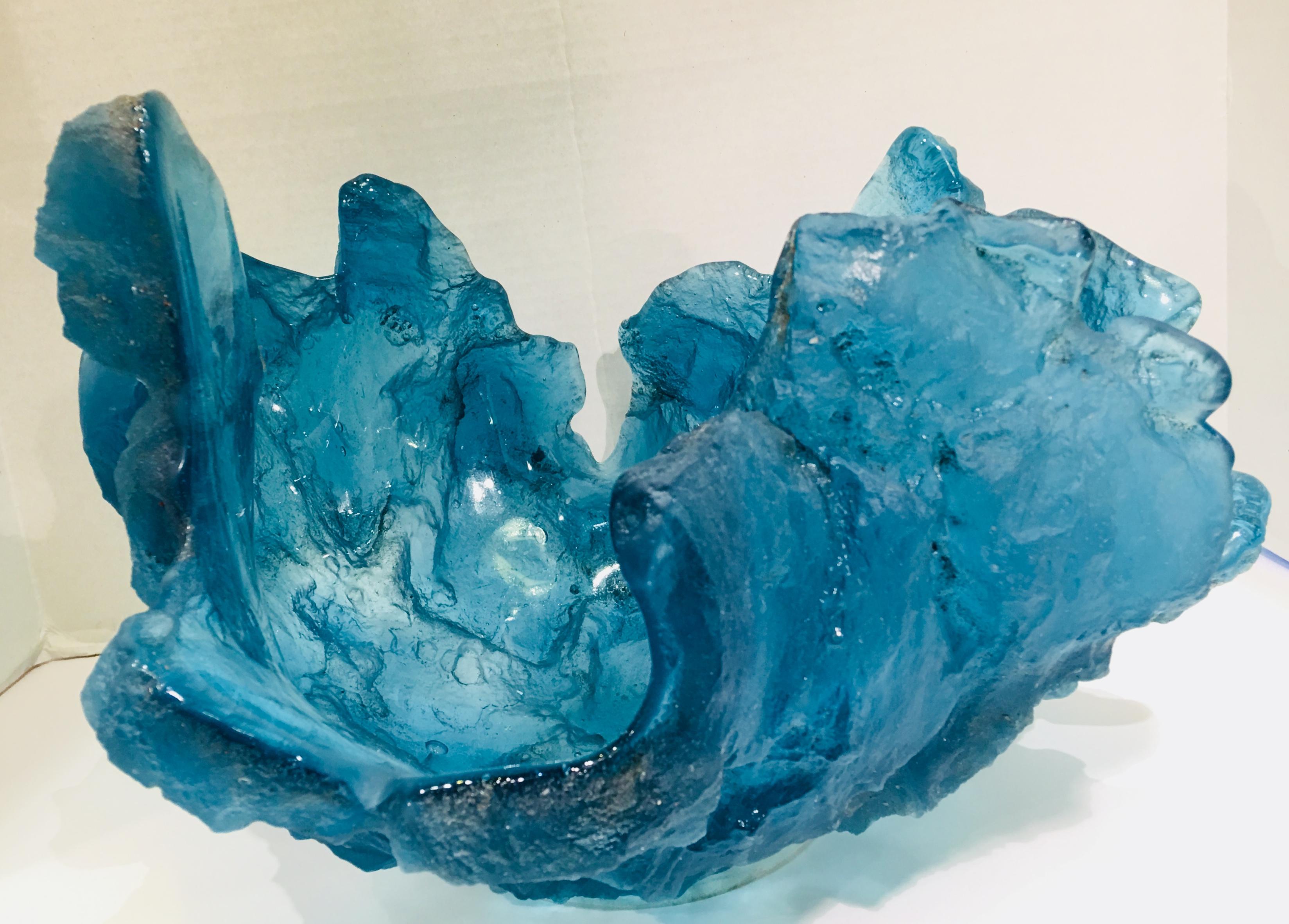 “Blue Frozen Water” is a vivid turquoise blue, dramatic sand cast art glass sculpture by deceased United Kingdom artist, Amanda Brisbane (1964-2016). 