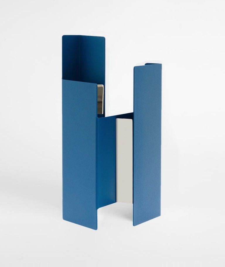 Blue fugit vase vase by Mason Editions
Dimensions: 12 × 15 × 34 cm
Materials: Iron 
Colours: sage green, petrol green, light grey, black, cotto, blue

Fugit vase consists of a metal sheet that seems to turn and close around itself, generating