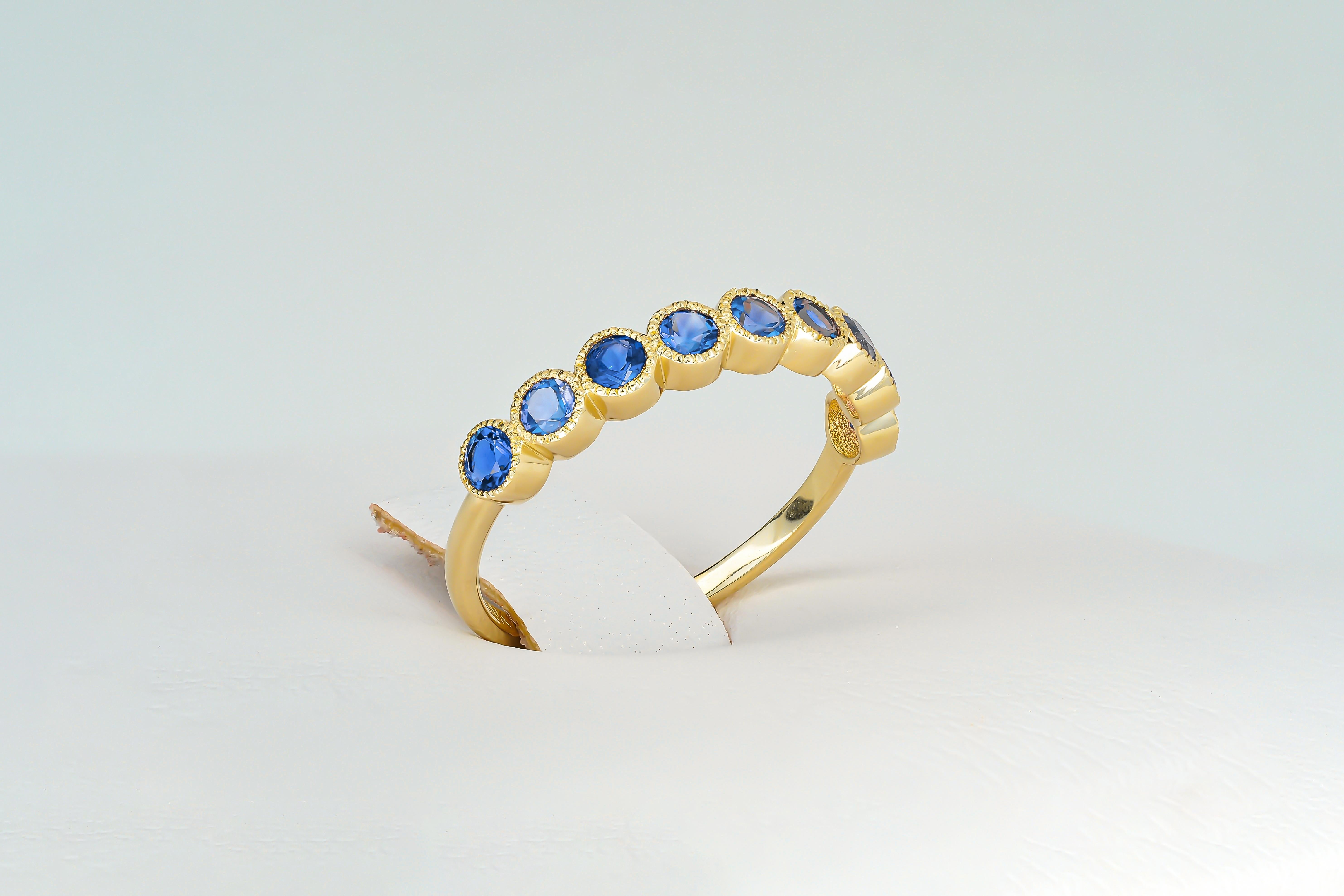 Blue gem half eternity 14k gold ring.
Lab sapphire semi eternity ring. Round blue gemstone gold ring. 2.5 mm lab blue sapphire ring.

Metal: 14k gold
Weight: 1.8 gr depends from size

Gemstones:
Lab sapphires, blue color, round cut, 2.5 mm size.