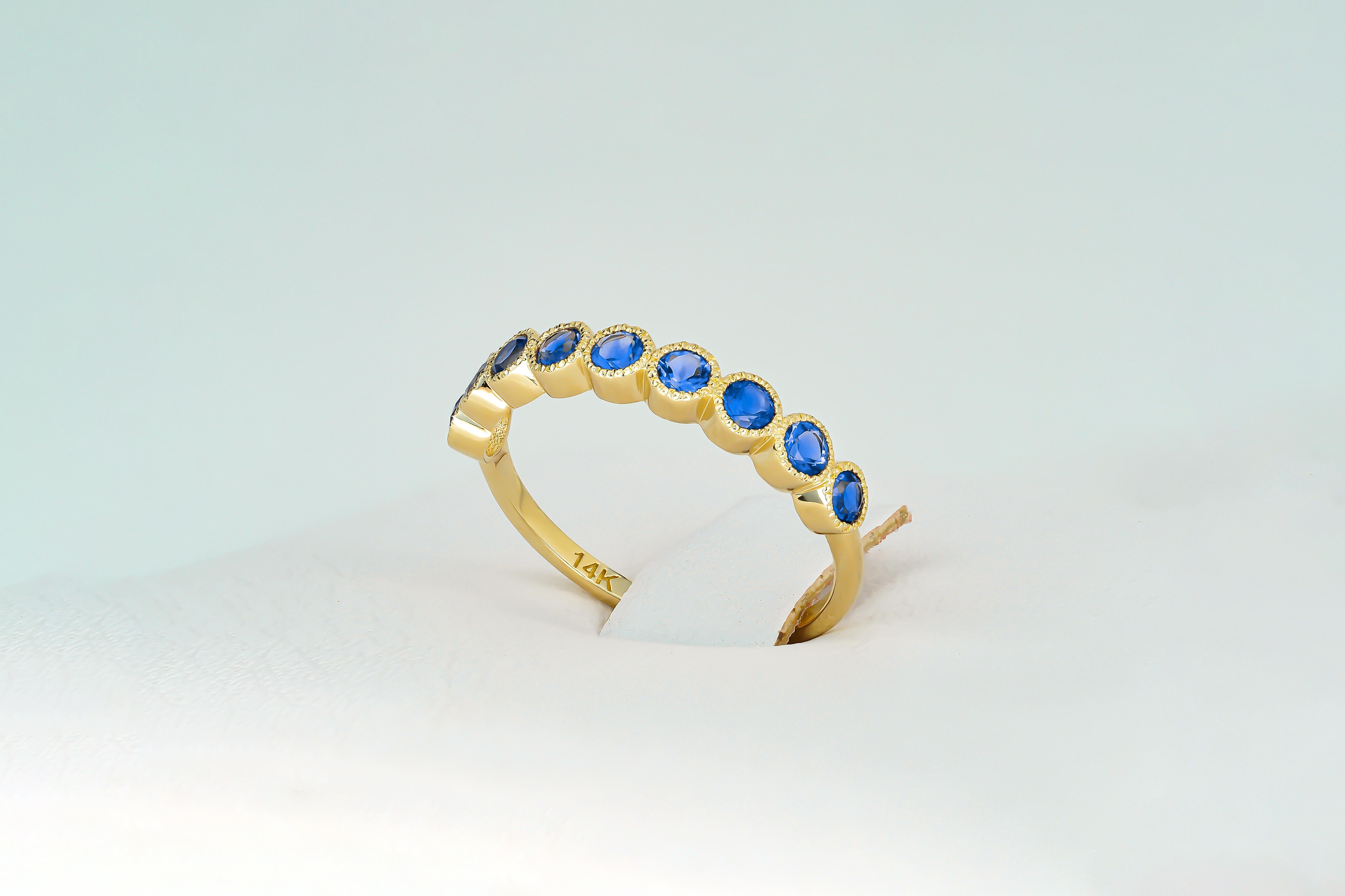 Modern Blue gem half eternity 14k gold ring. For Sale