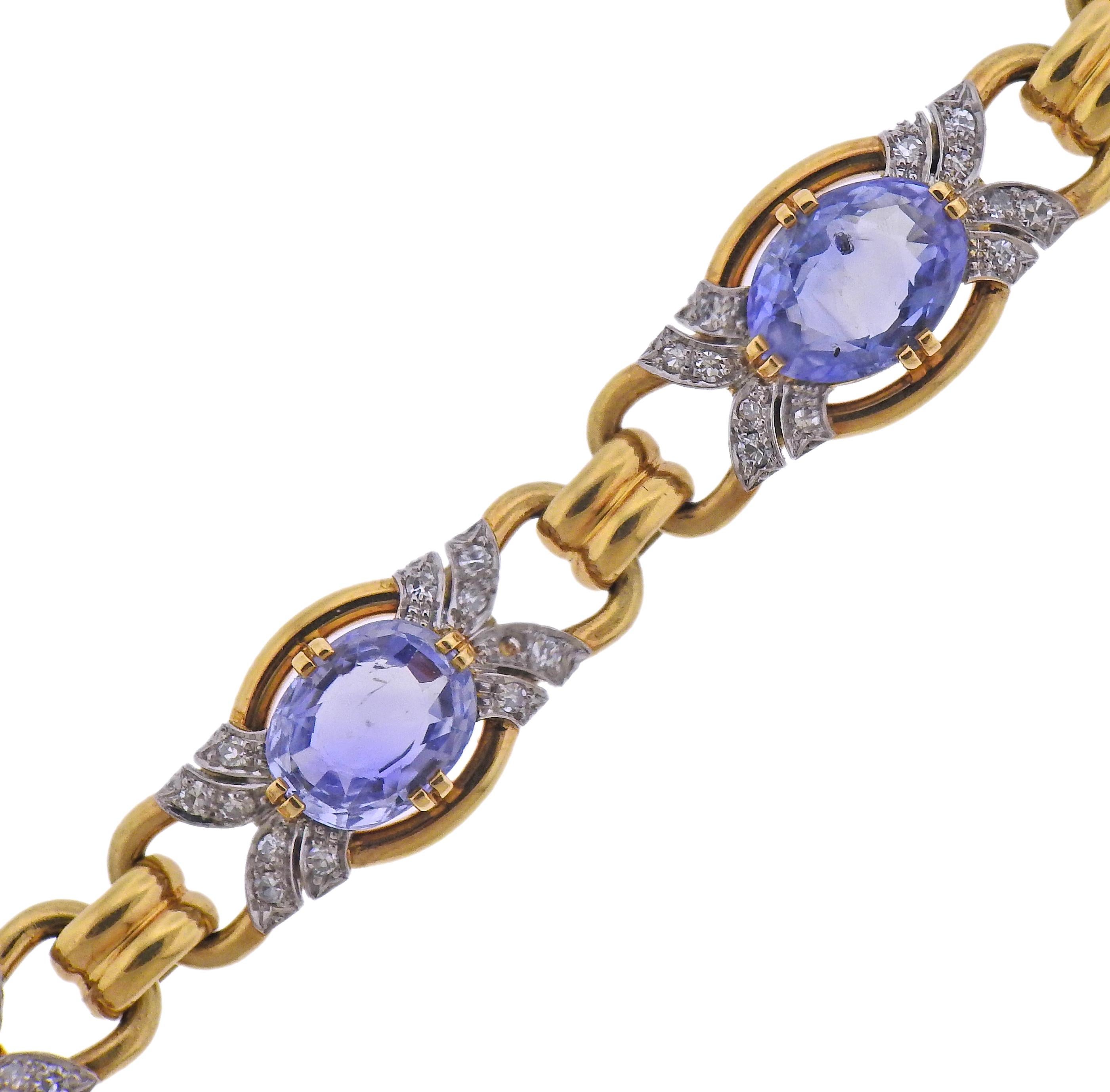 18k gold bracelet, with six oval blue stones - measuring from 10 x 7mm to 11.5 x 8.5mm, surrounded with approx. 0.80ctw in diamonds Bracelet is 7 1/8