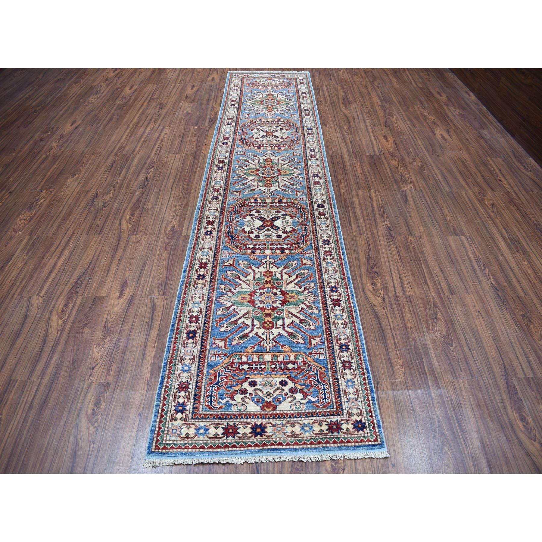 This is a truly genuine one-of-a-kind blue geometric super Kazak handmade runner oriental rug. It has been knotted for months and months in the centuries-old Persian weaving craftsmanship techniques by expert artisans. Measures: 2'10
