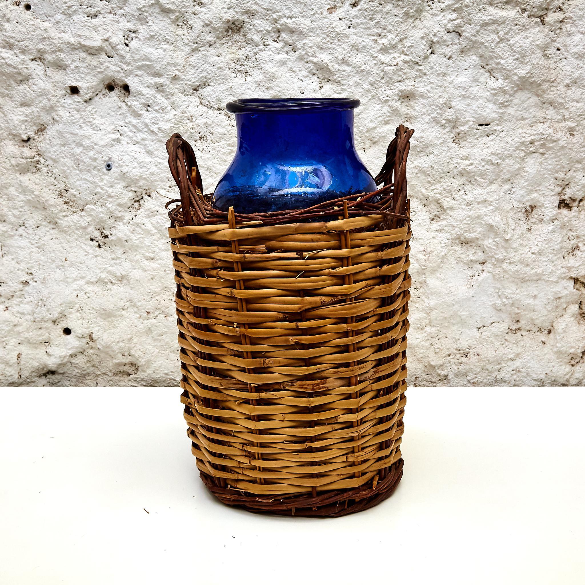 Mid-20th Century Blue Glass Bottle with Wicker Basket, circa 1930 For Sale