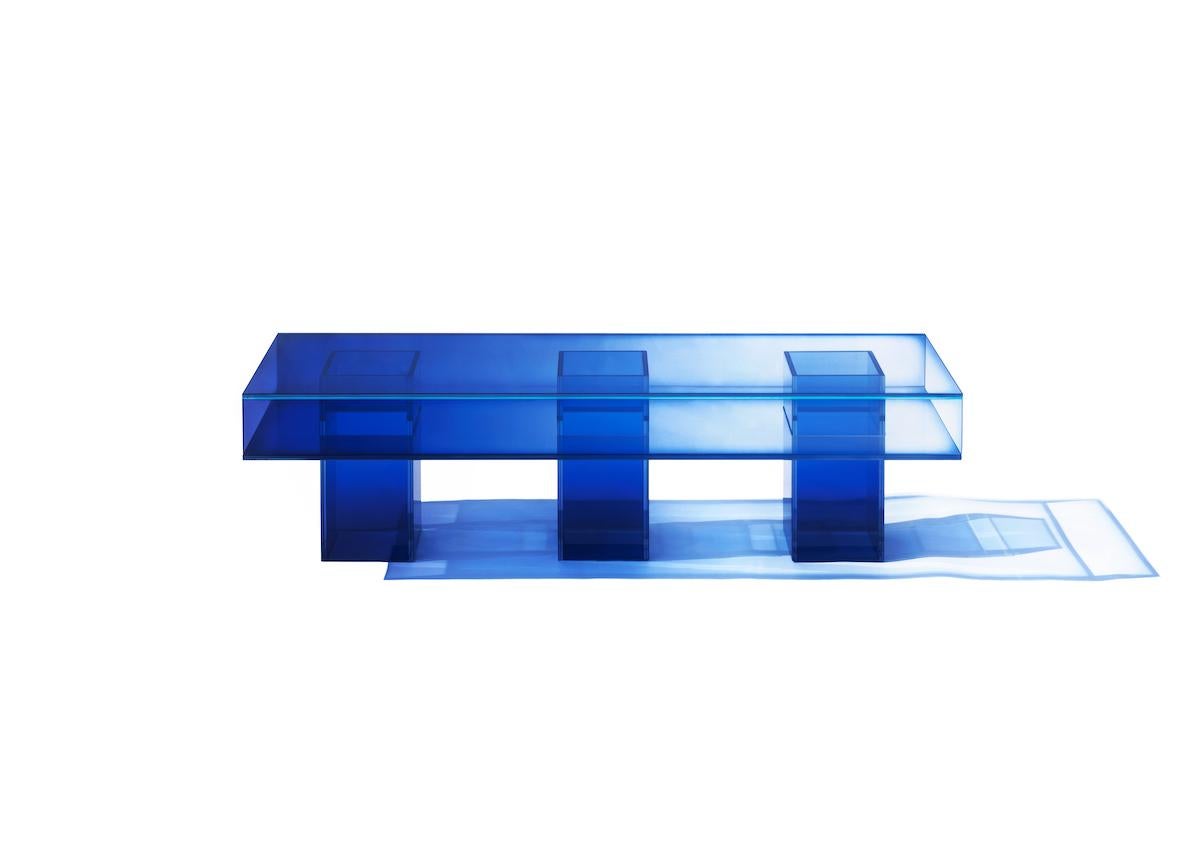 This long square bench is made with compound glass in blue color. Size and color are customizable upon request. 

Studio Buzao is an experimental design studio. It tempts to breakthrough the difference between product and artwork by immersing the