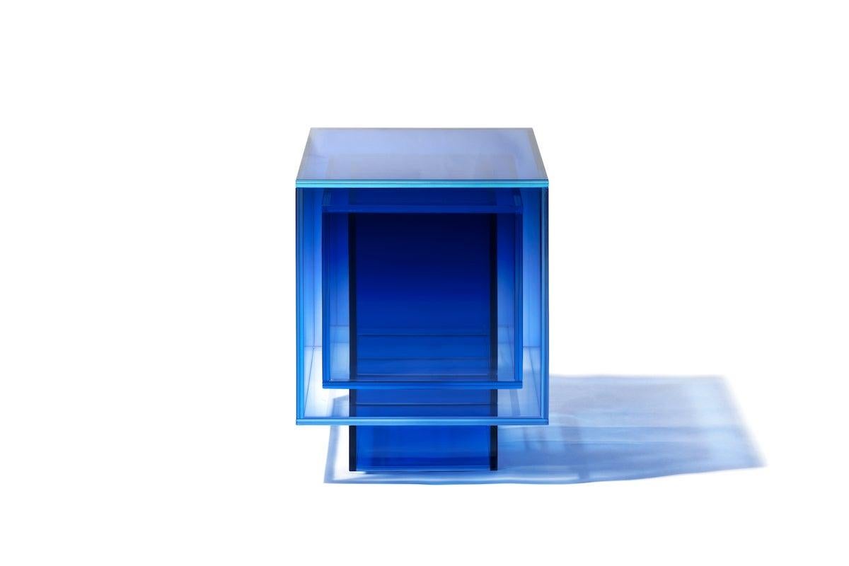 This square table is made of laminated glass in blue color. Size and color are customizable upon request. 

Studio Buzao is an experimental design studio. It tempts to breakthrough the difference between product and artwork by immersing the
