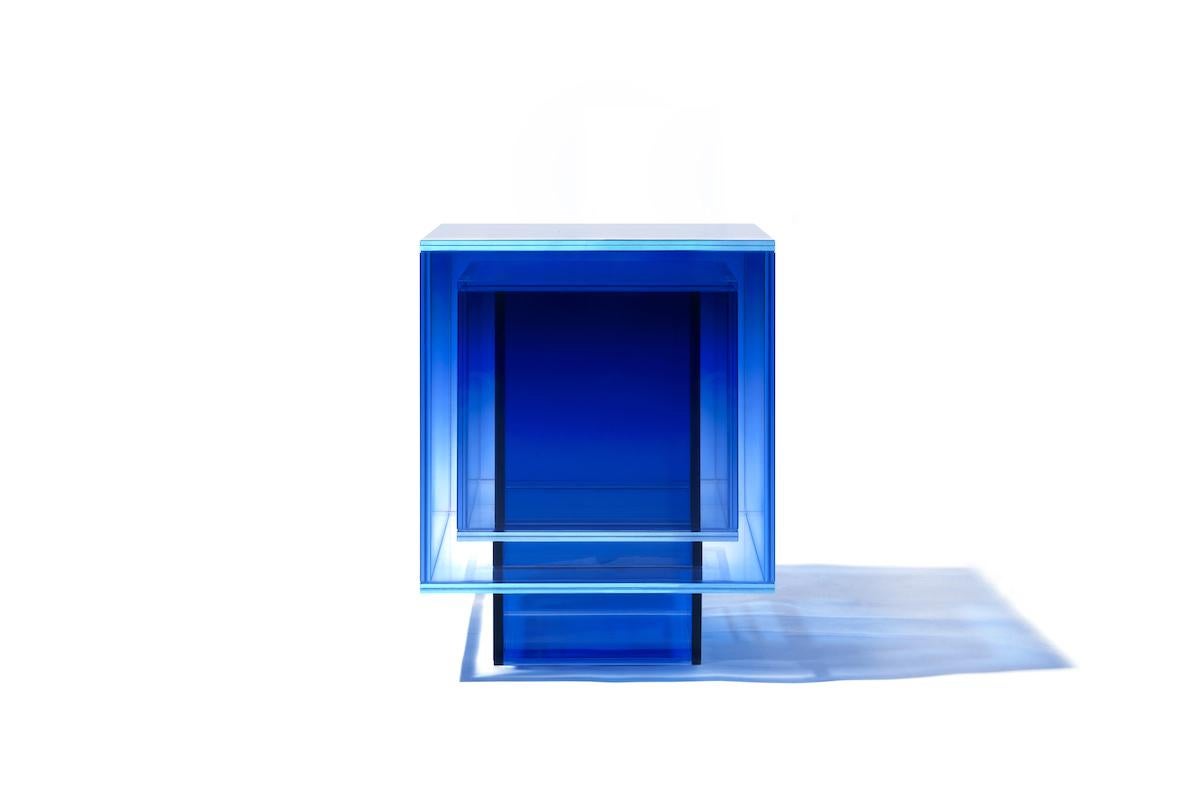 This square table is made of laminated glass in blue color. Size and color are customizable upon request. 

Studio Buzao is an experimental design studio. It tempts to breakthrough the difference between product and artwork by immersing the