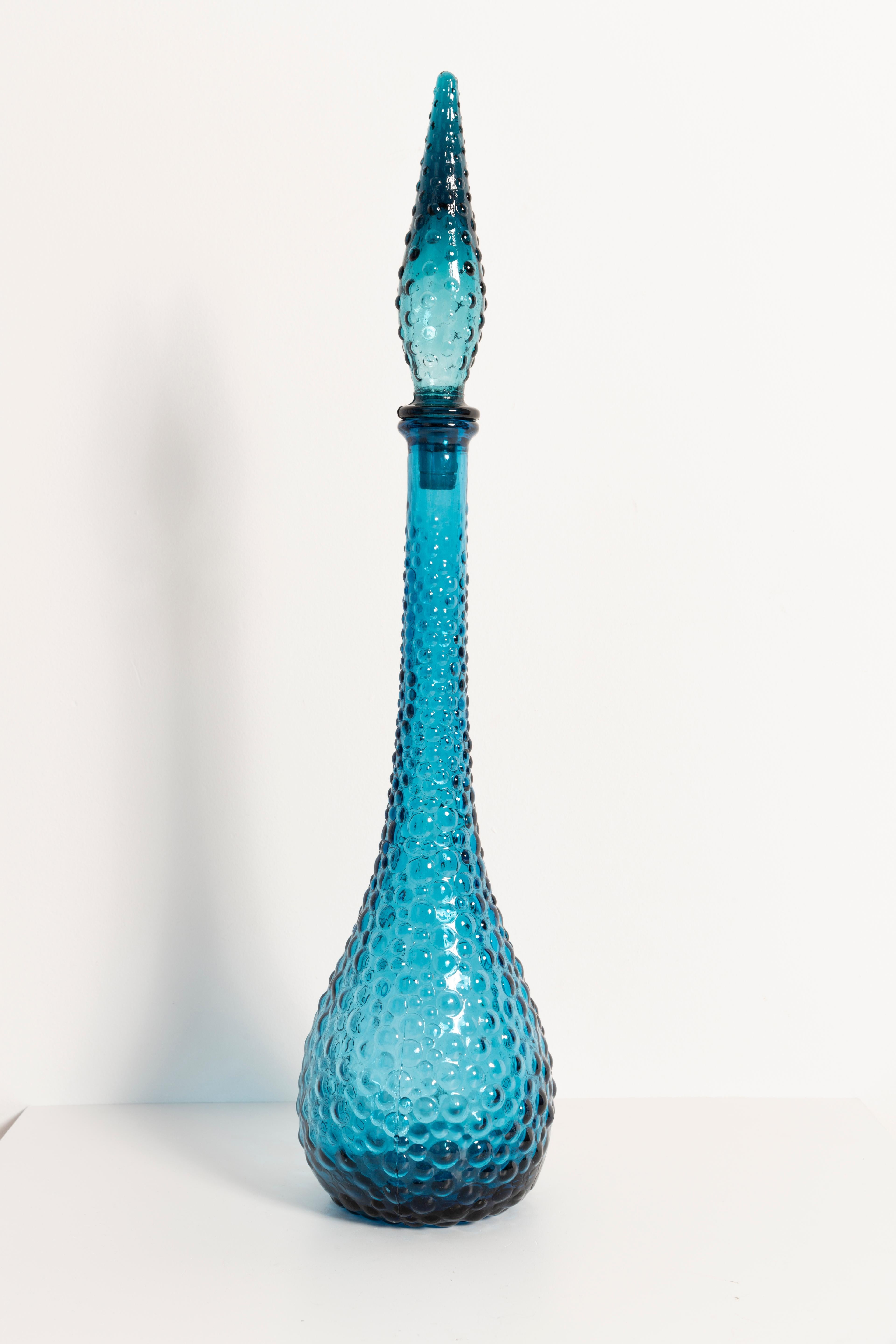 A stunning blue decanter with geometric design, made by one of the many glass manufacturers based in the region of Empoli, Italy. Would make a great addition to any collection! Excellent condition, no chips or cracks other than a couple of