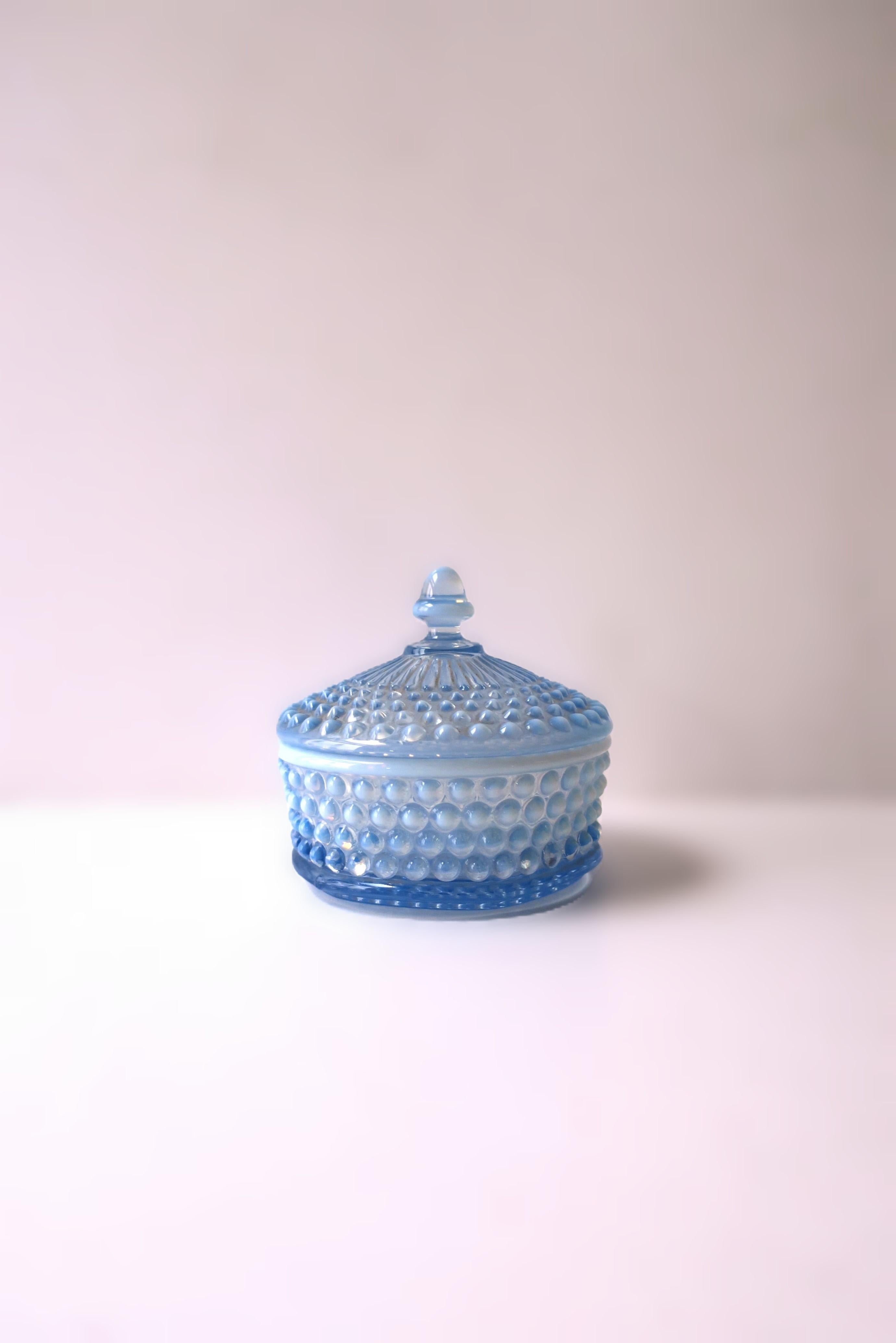 A beautiful blue opaline ombre hobnail art glass vanity box, circa 20th century. Box with hobnail design, blue opaline and ombre hue, finished with a knob lid; a great piece for a vanity, dresser, walk-in-closet, cocktail table, etc., to hold