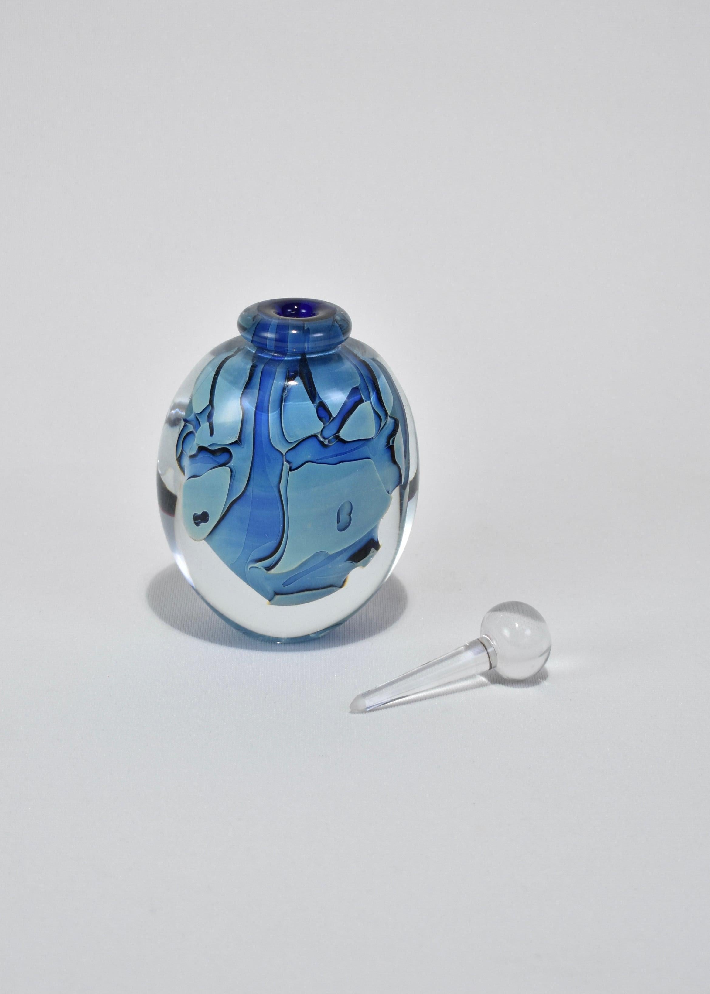 Beautiful vintage blown glass perfume bottle in blue with abstract design. Signed on base, Robert Eickholt.
 