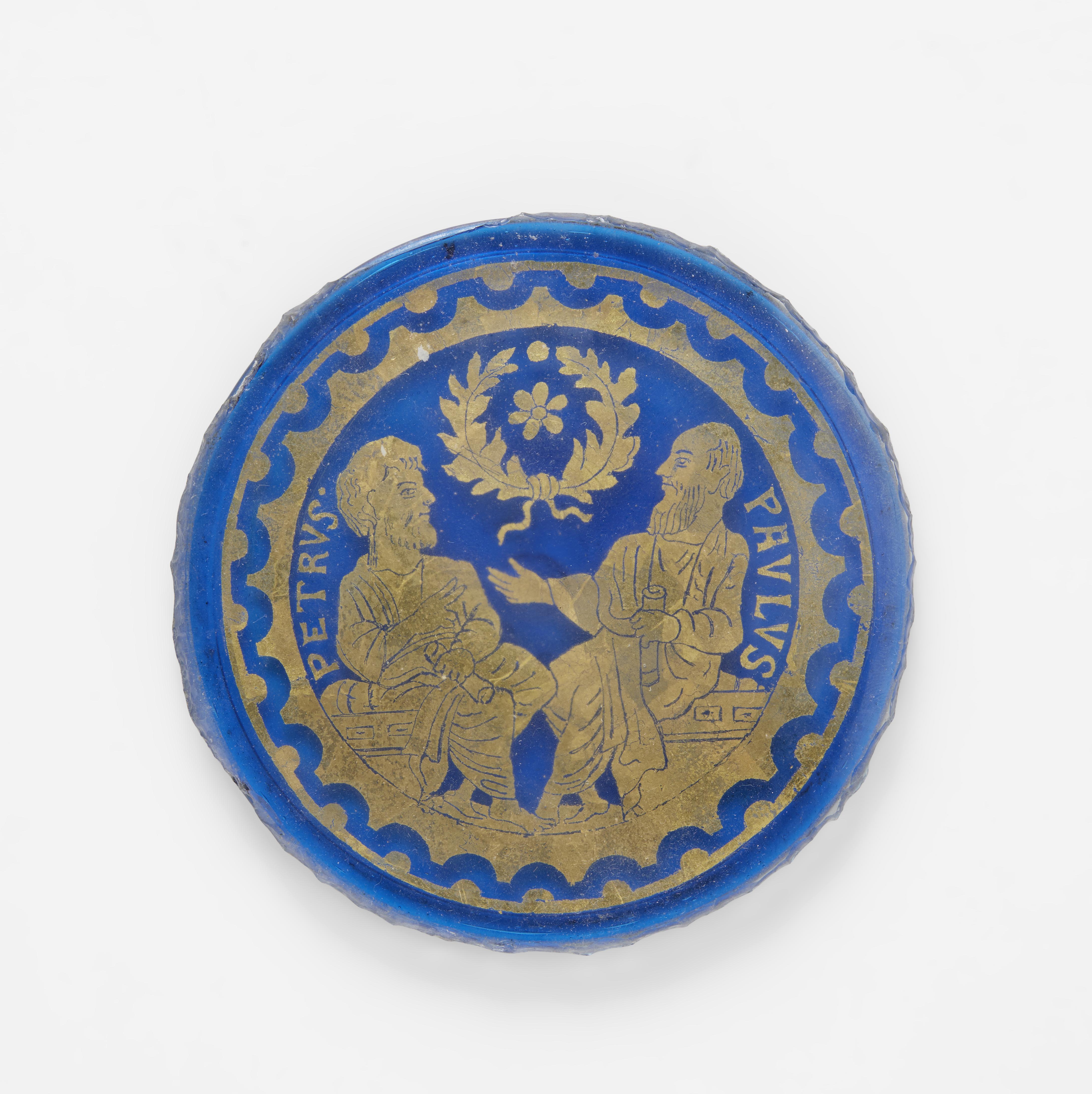 Venetian Blue Glass Romanesque Revival Medallion circa 1890 was produced by the Venice & Murano Glass & Mosiac Co. (1872-1919). The iridescent blue tinted glass is hand painted and decorated with gilt on the front surface. These decorative roundels