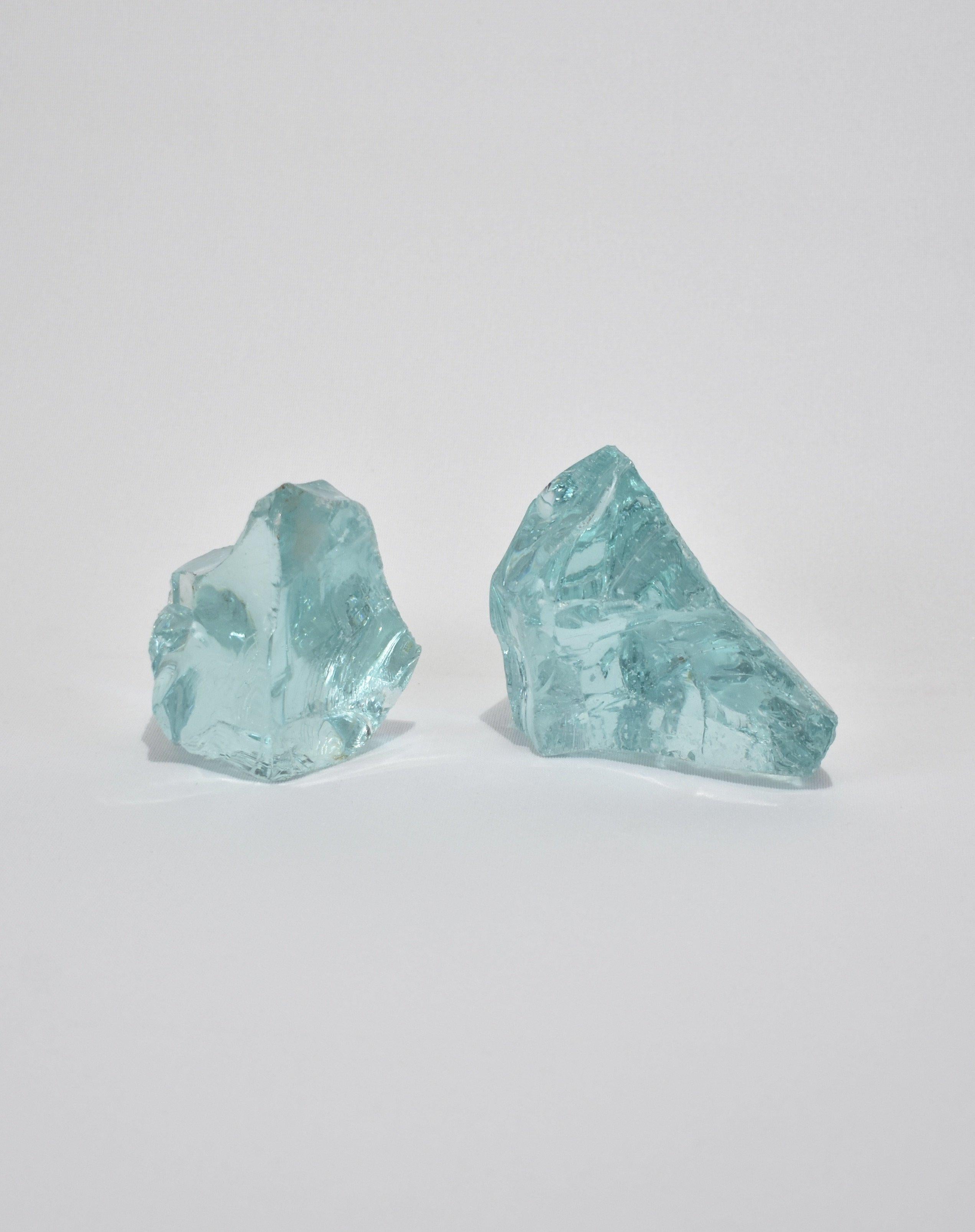 Slag glass sculpture set in beautiful aqua blue. Display on their own or with an arrangement of books as bookends.

Dimensions
3.5