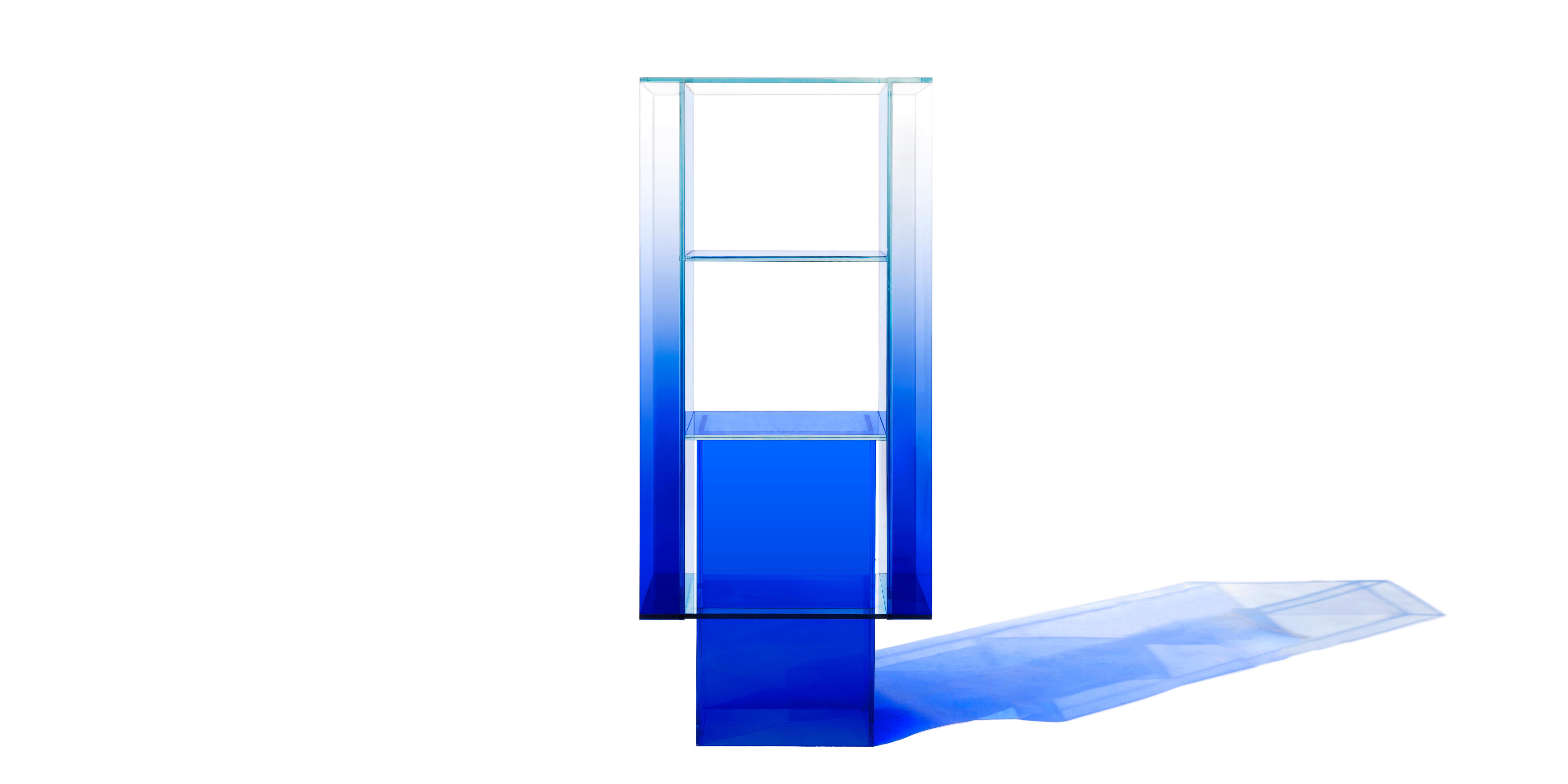 This standing shelf is made with compound glass in blue color. Size and color are customizable upon request. 

Studio Buzao is an experimental design studio. It tempts to breakthrough the difference between product and artwork by immersing the