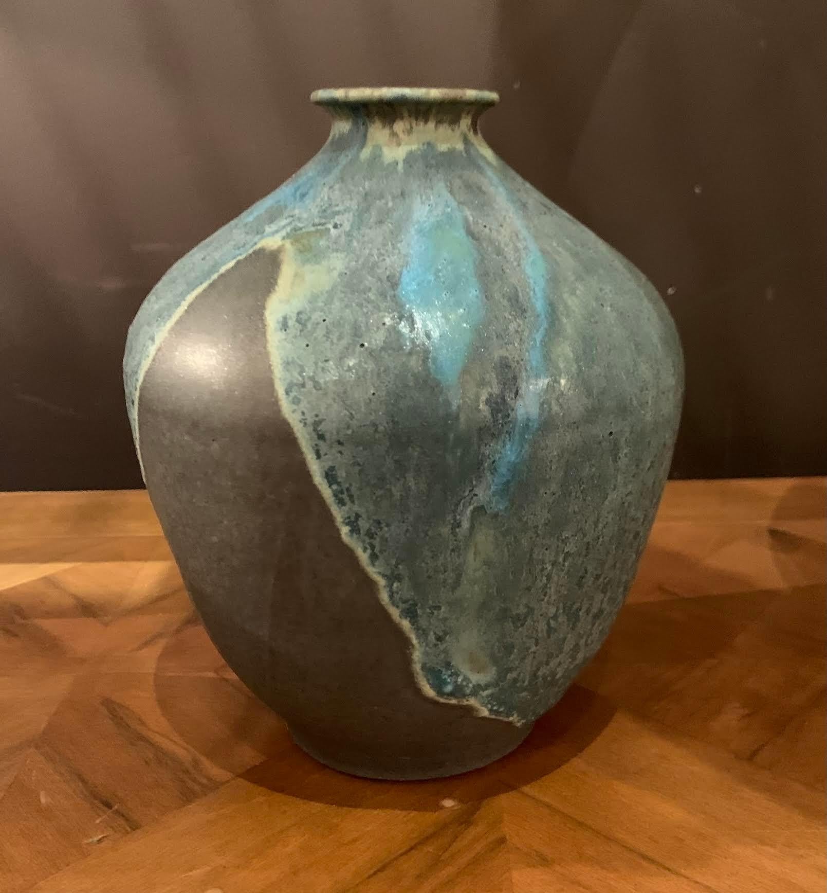 Contemporary American Ceramist Peter Speliolpoulos stoneware vase.
One of many pieces from a large collection of work.
See image #4
Signed by the artist.
The matte blue glaze, paired with an agate glaze, react to create pieces with a mineral