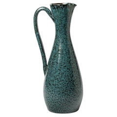 Blue glazed ceramic pitcher by Accolay, circa 1960-1970.