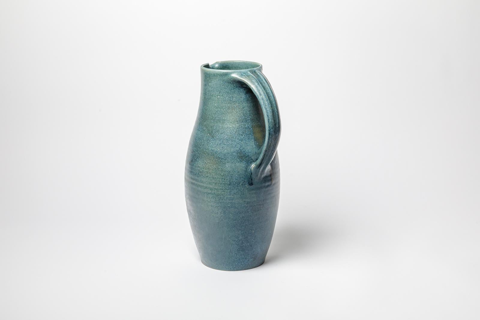 Beaux Arts Blue glazed ceramic pitcher by Roger Jacques, circa 1960-1970. For Sale