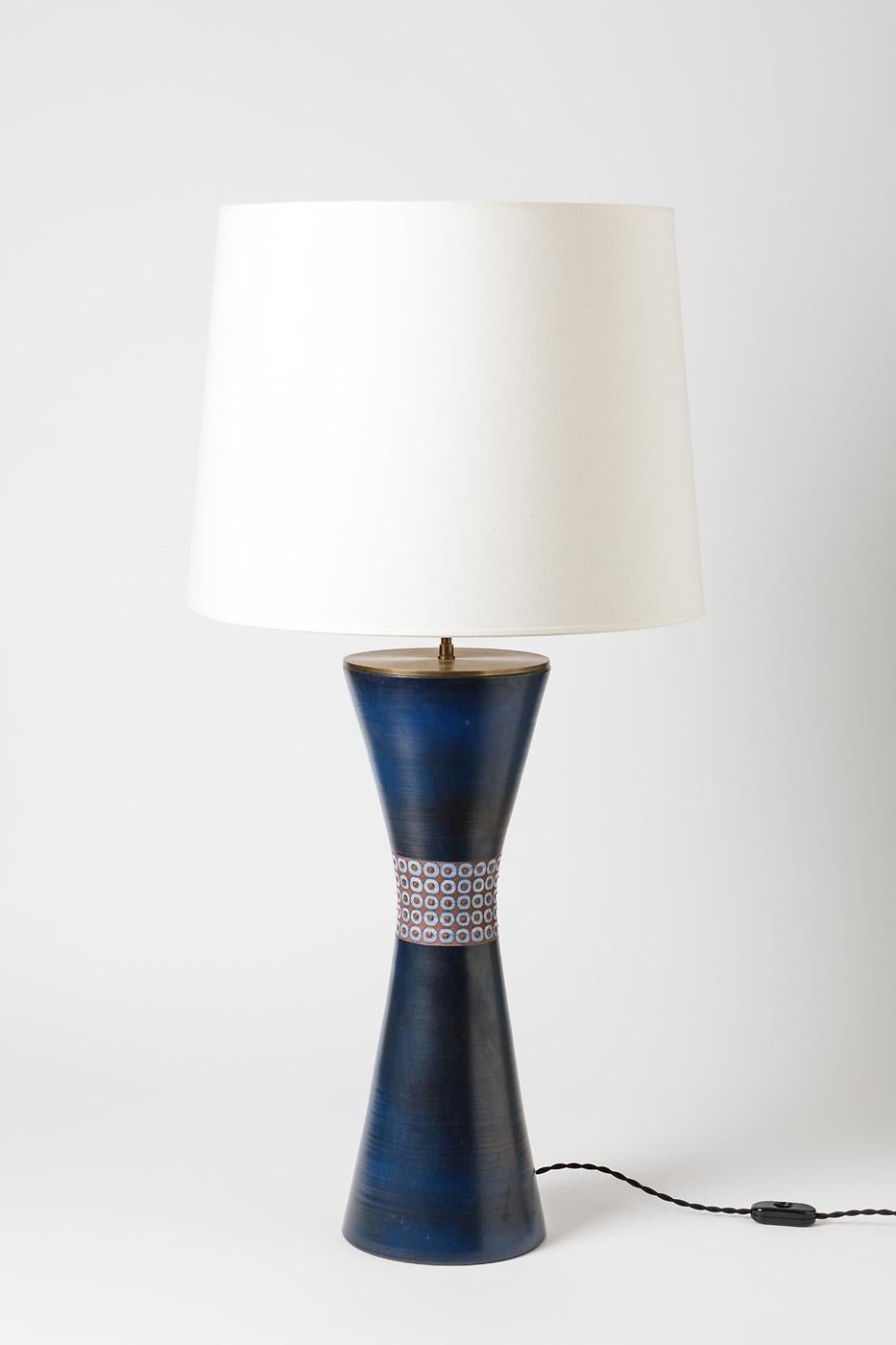 Blue glazed ceramic table lamp by René Morel. 
Artist signature under the base. Circa 1960-1970. 
H : 18.7 x 6.9 (ceramic only).
Sold with a European electrical system.