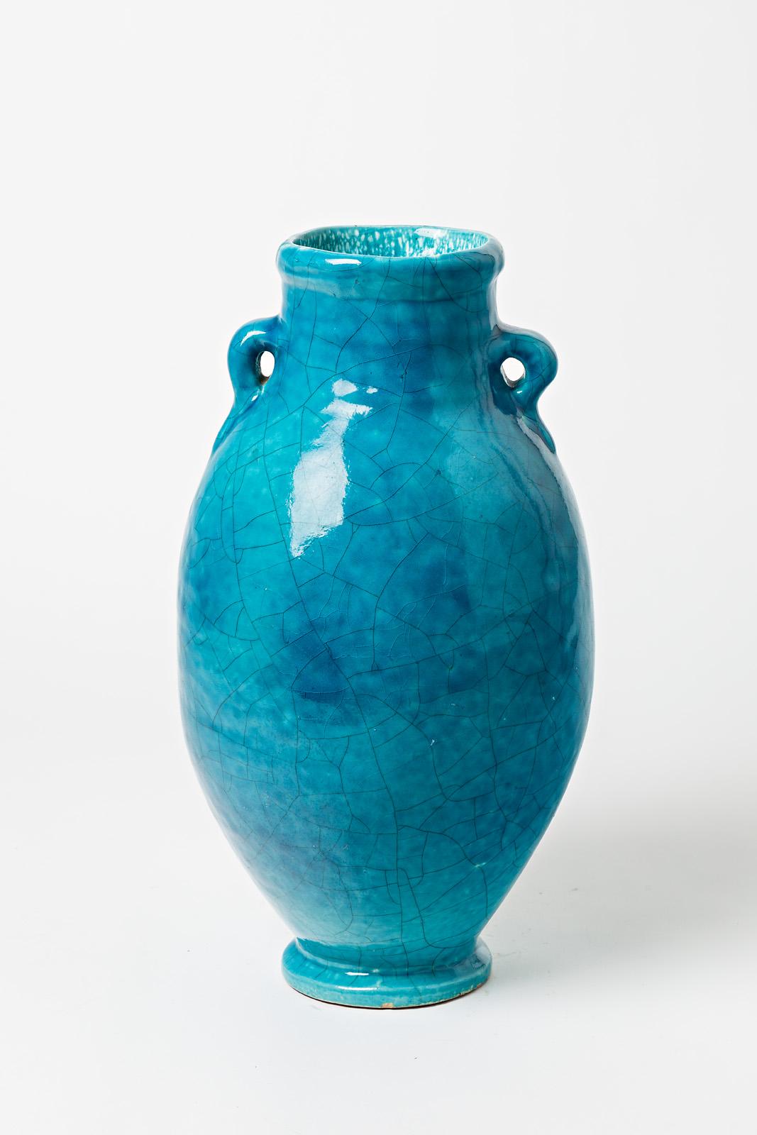 Blue glazed ceramic vase by Raoul Lachenal.
Artist signature under the base « Lachenal ». 
Circa 1930.

H : 15.3’ x 7.9’ x 7.5’ inches.