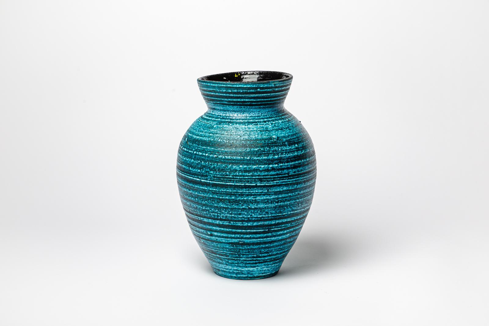 Blue glazed ceramic vase by Accolay.
Artist signature under the base. Circa 1960-1970. 
H : 12.9’ x 8.3’ inches.