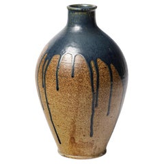 Blue glazed ceramic vase by Lucien Arnaud, circa 1920.