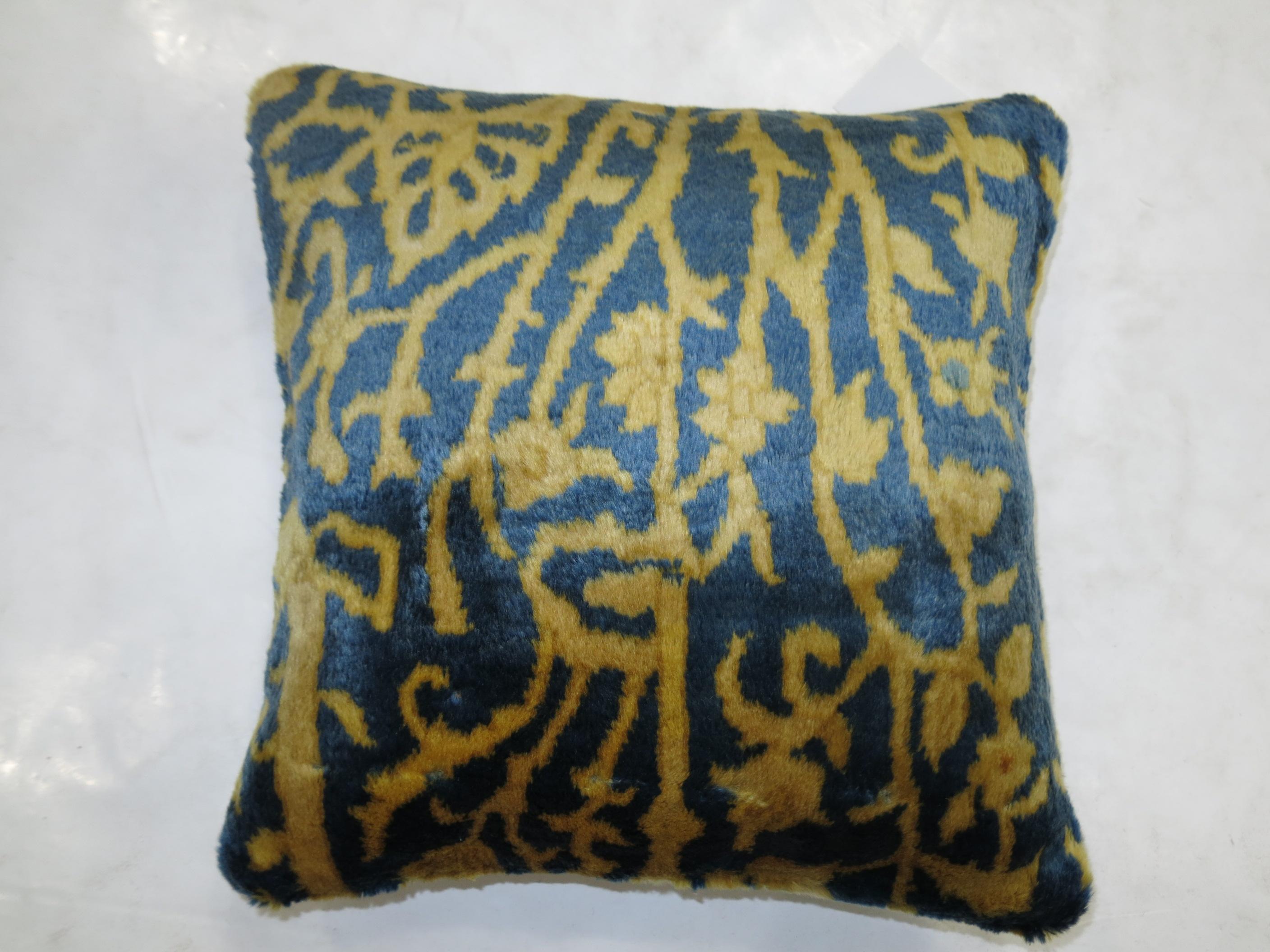 Pillow made from a vintage Indian Agra rug featuring fluffy wool in blue and gold. zipper closure and poly fill insert provided

Measures 16'' x 16'' square.