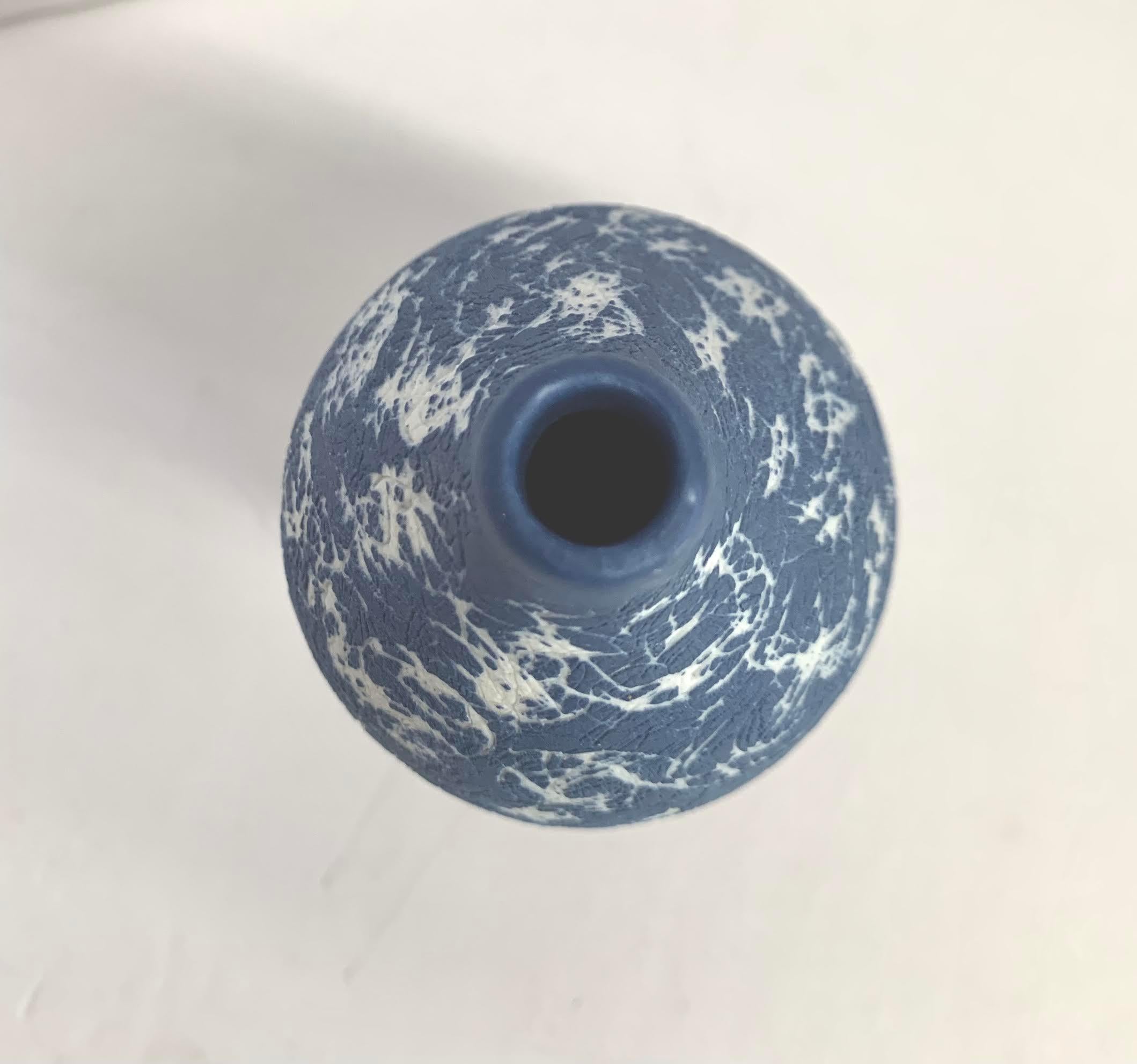 Contemporary Italian hand made ceramic blue graffiti design vase.
The matte glaze has a slight texture.
Part of a large collection of blue and white diminutive vases.
See image #4.