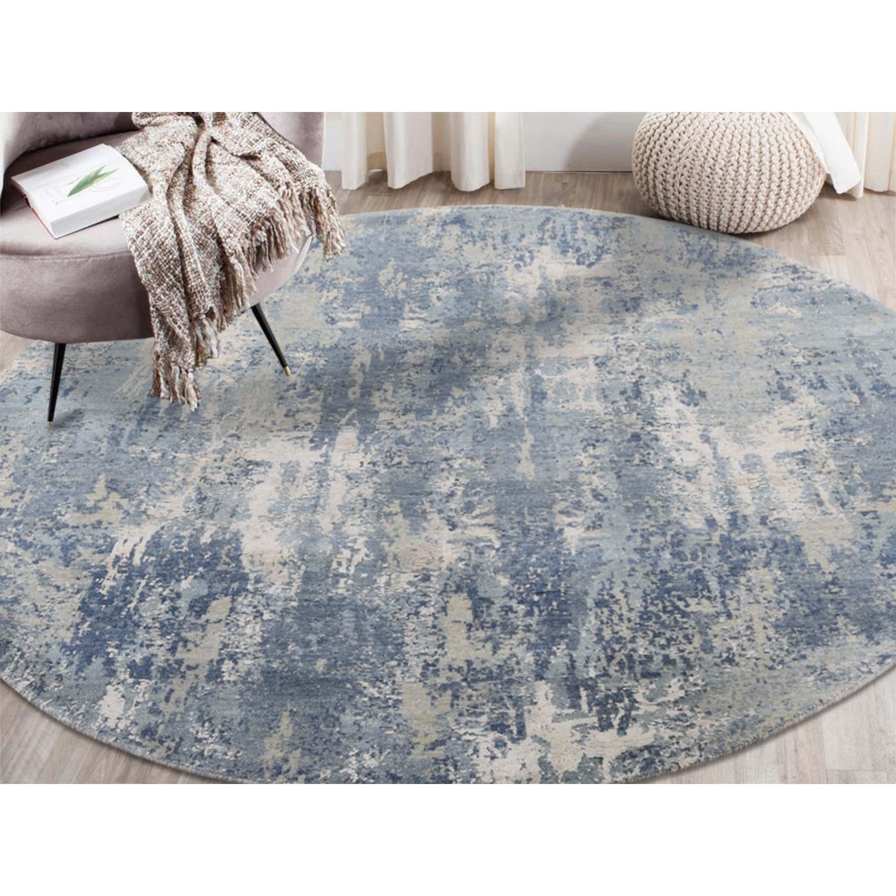 This is a truly genuine one-of-a-kind blue-gray abstract design wool and pure silk handmade round Oriental rug. It has been knotted for months and months in the centuries-old Persian weaving craftsmanship techniques by expert artisans. Measures: