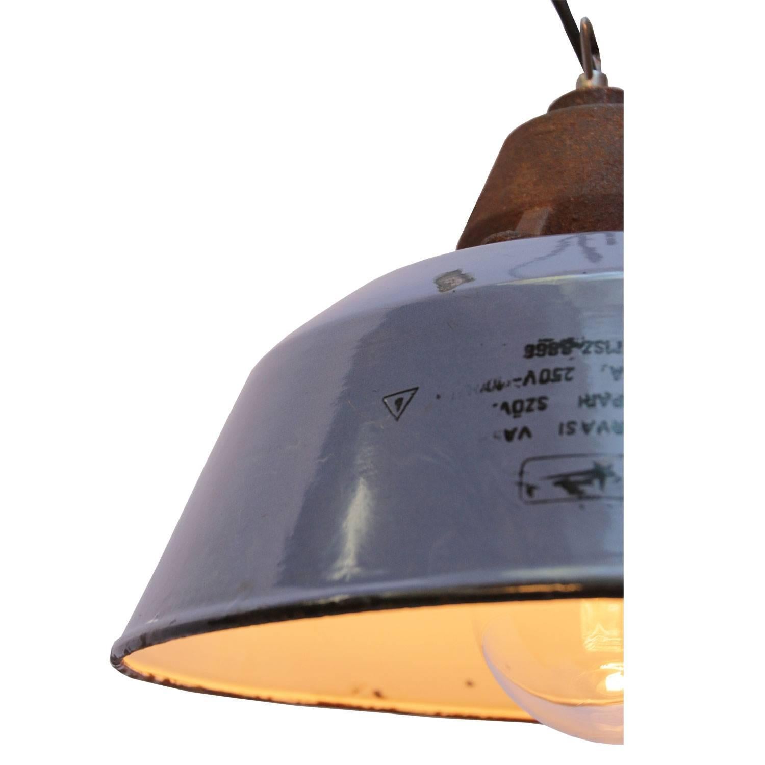 Factory pendant. Blue enamel white interior. Cast iron top with clear glass.

Weight: 3.4 kg / 7.5 lb

Priced per individual item. All lamps have been made suitable by international standards for incandescent light bulbs, energy-efficient and