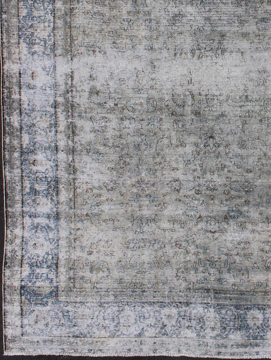 Blue/grey vintage Persian distressed rug with modern and rustic design in shades of gray and ivory, rug crv-10046466, country of origin / type: Iran / distressed modern, circa 1950.

This Persian rug is one-of-a-kind with a distressed finish that