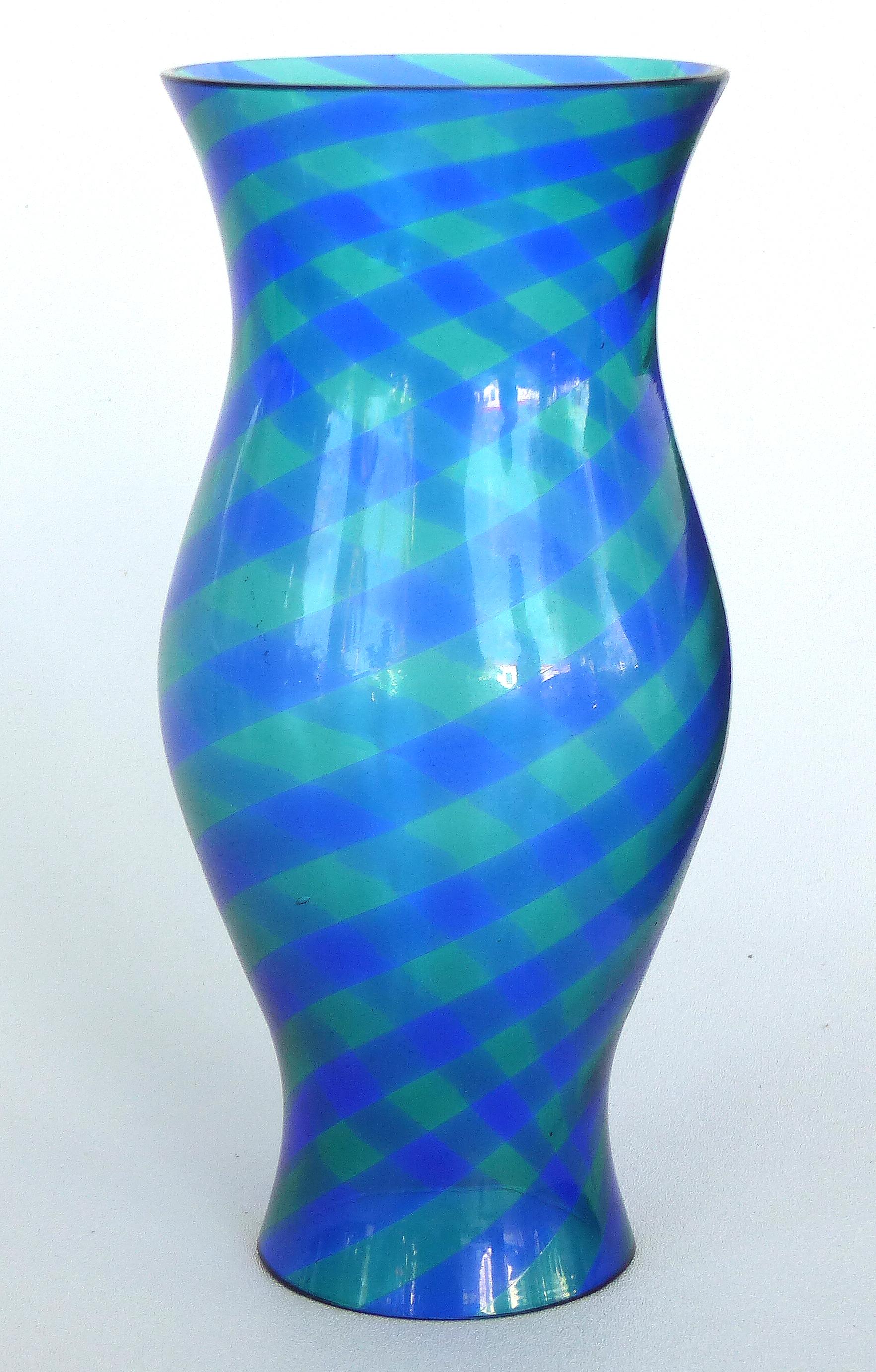 Offered for sale is a pair of blue and green blown glass hurricane shades with a swirled striped pattern.