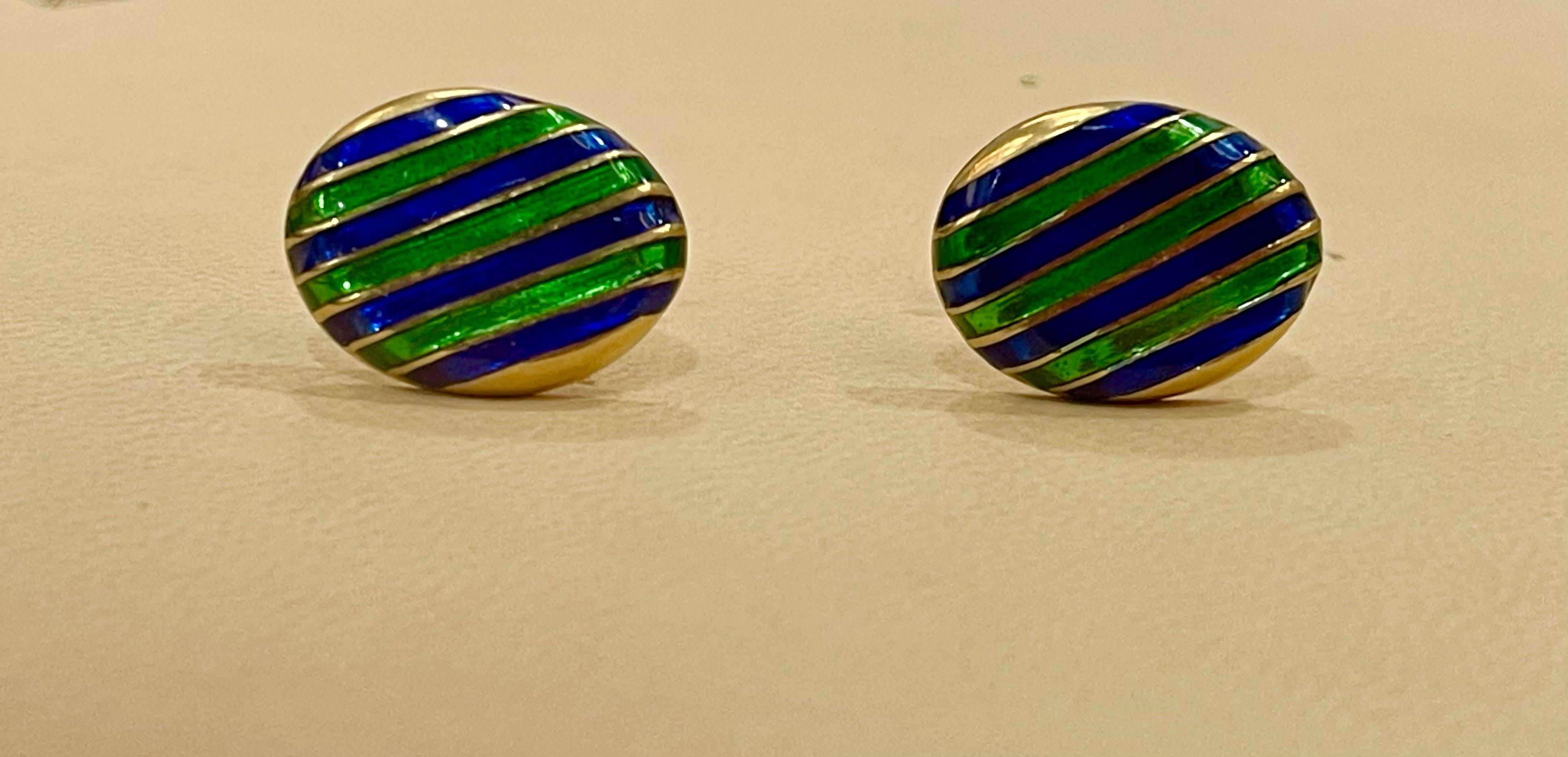 Its Vintage 
Classic cufflinks in high-polished 14 karat yellow gold, with green and blue enamel on them. 
measurements   21 X 16 mm.
14 Karat Yellow gold 
Gold weight 15.5 Gm
Beautiful vintage piece



I did not take professional pictures, all