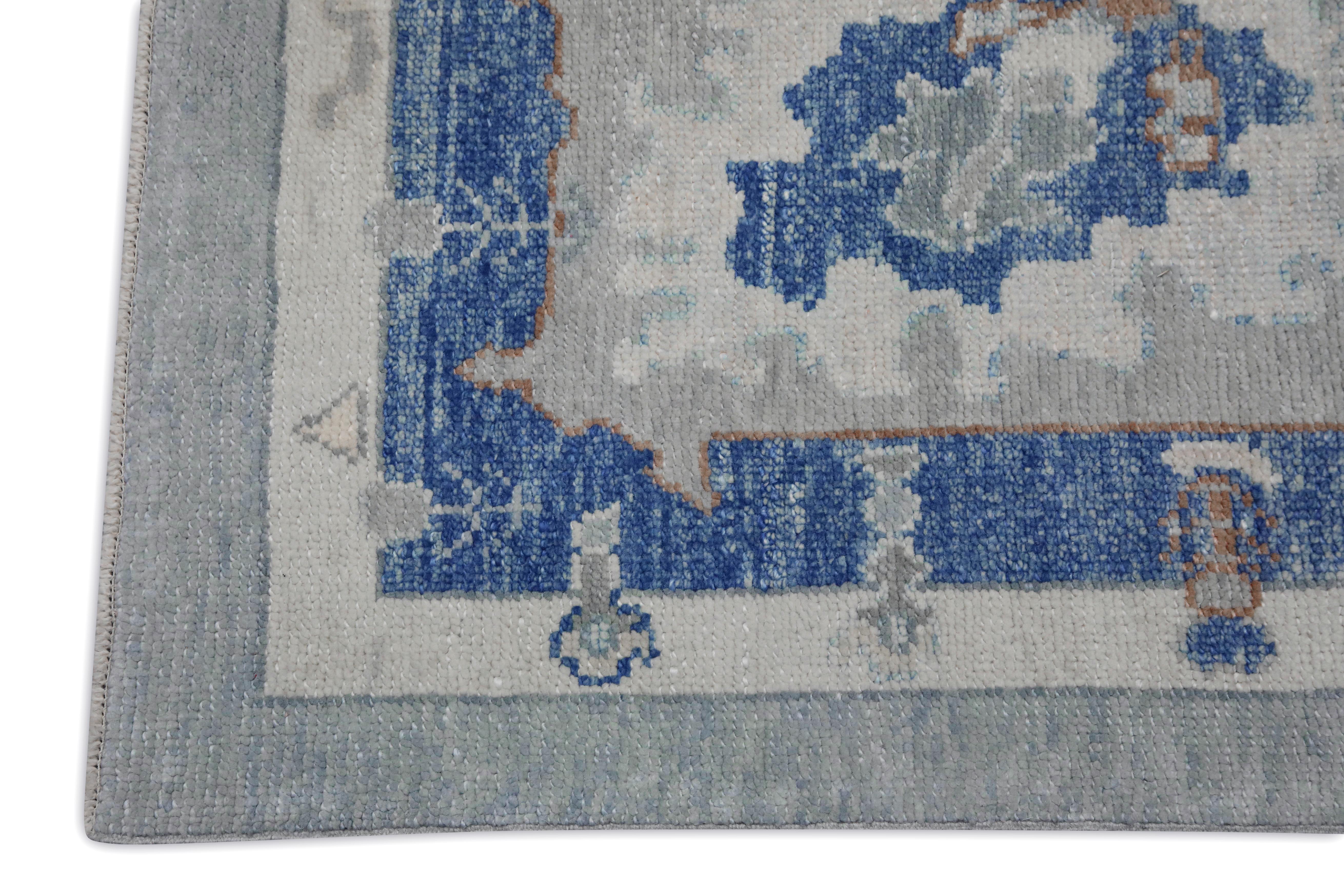 Alfombra turca Oushak de lana tejida a mano con diseño floral azul y verde 11'4