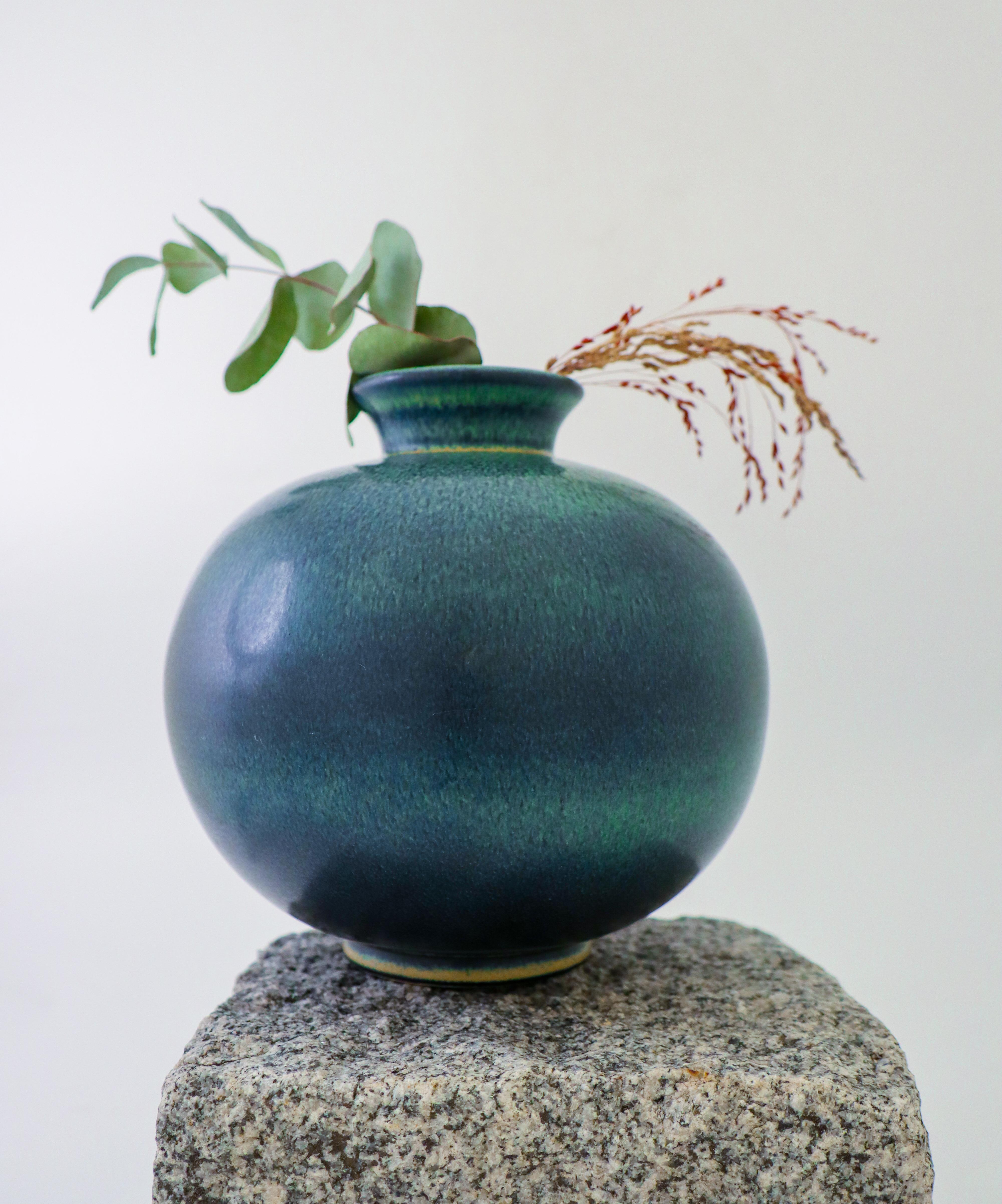 A blue & green ceramic vase designed by Gunnar Nylund at Rörstrand. It is 17.5 cm (7