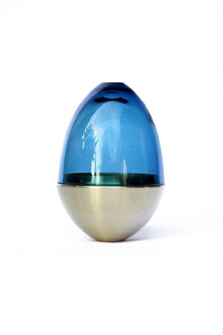 Blue Green Homage to Faberge jewellery egg, Pia Wüstenberg
Dimensions: D 13.5 x H 20
Materials: glass, metal
Available in other metals: brass, copper, brass patina

The contemporary reinterpretation of the famous jewellery egg.
Handmade in